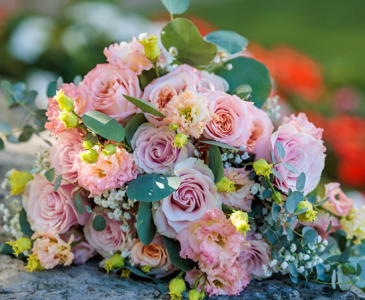 Soft pink &amp; peach roses, champagne lisianthus, and a delicate touch of babies breath&mdash;added specially at our bride&rsquo;s request&mdash;came together to create Rachel&rsquo;s romantic, organic bridal bouquet. Her bridesmaids carried simplif
