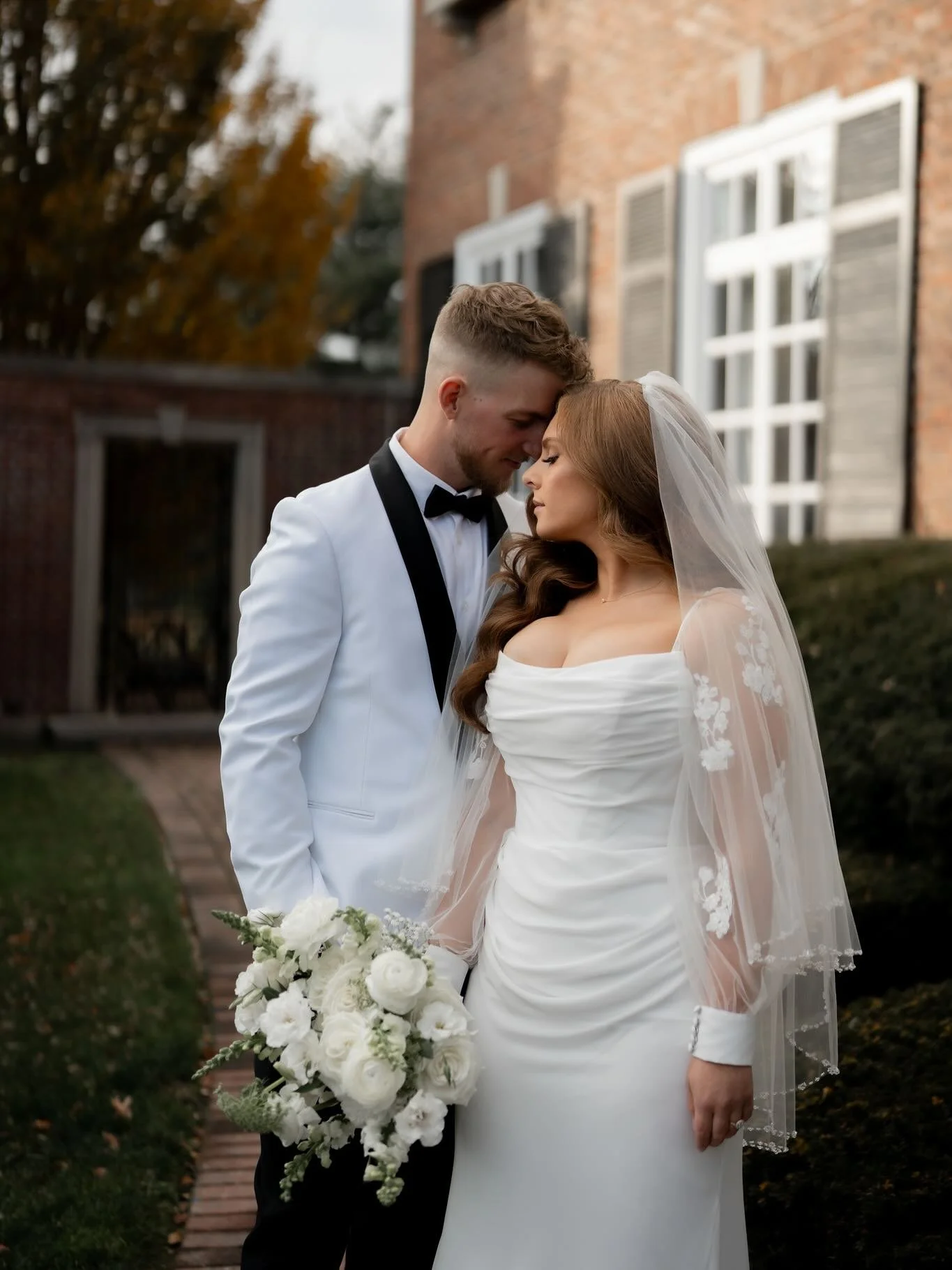 Pt. 2 &ndash; The Wedding Day

Alexandria &amp; Michael brought their black-and-white vision to life with elegant personal flowers, a romantic ceremony arch, and centerpieces featuring lush white blooms paired with candlelit candelabras and floating 