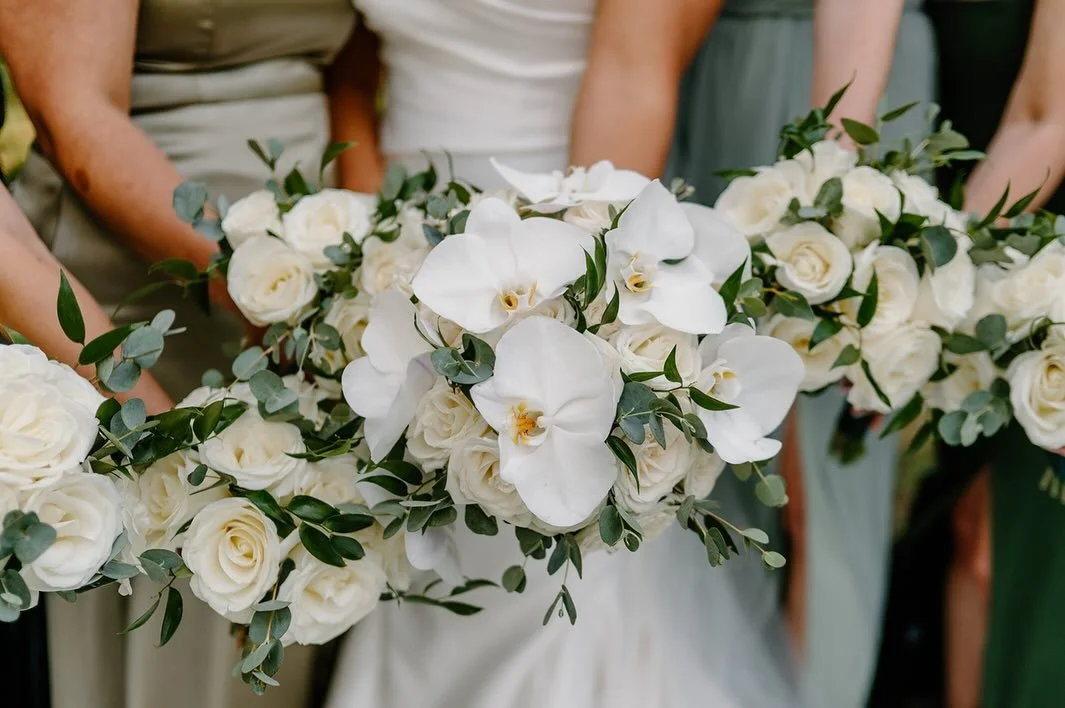 A timeless palette of delicate white blooms and lush greenery for Katie &amp; Sal&rsquo;s September wedding 🤍
As high school sweethearts, they shared with us that orchids were part of their prom night &mdash; so they thoughtfully included them again