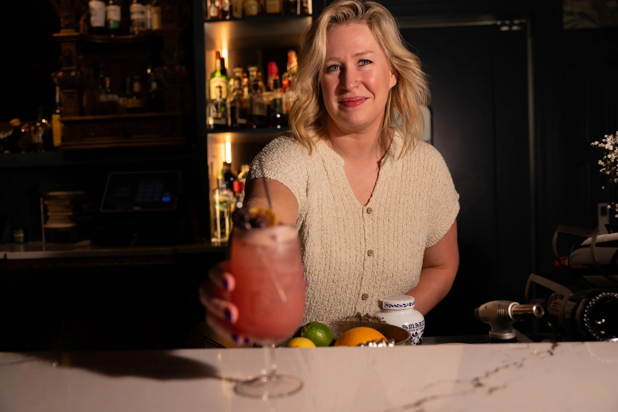 Rachel Smalling, owner of 1854 Cocktail Bar & Lounge, behind the bar crafting an unhurried, upscale lounge experience in Cookeville.