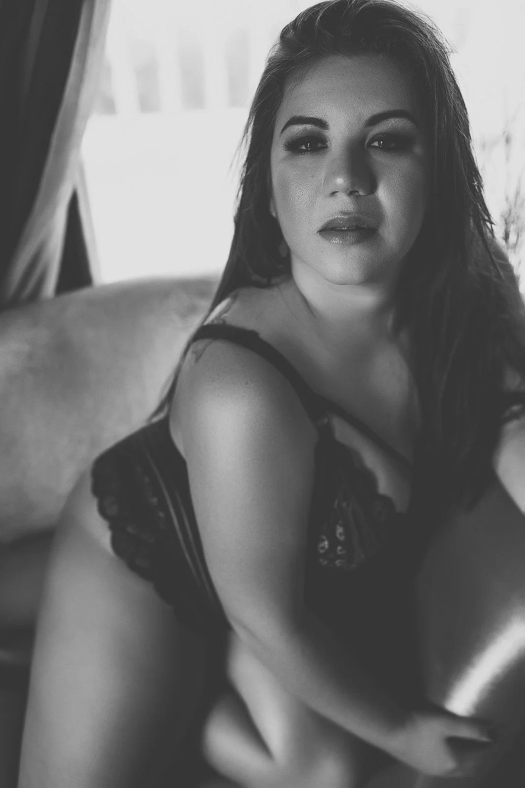 Bentonville Arkansas boudoir photographer, black and white seated portrait in dark lingerie