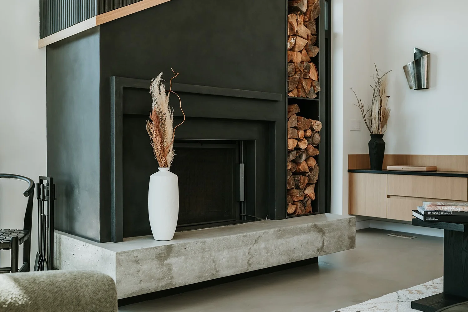 Sunstone Custom fluted asymmetrical fireplace (WL Design 25 winner detail) — new-build interior design in Pemberton, BC by LRD Studio. Photography by Darby Magill.