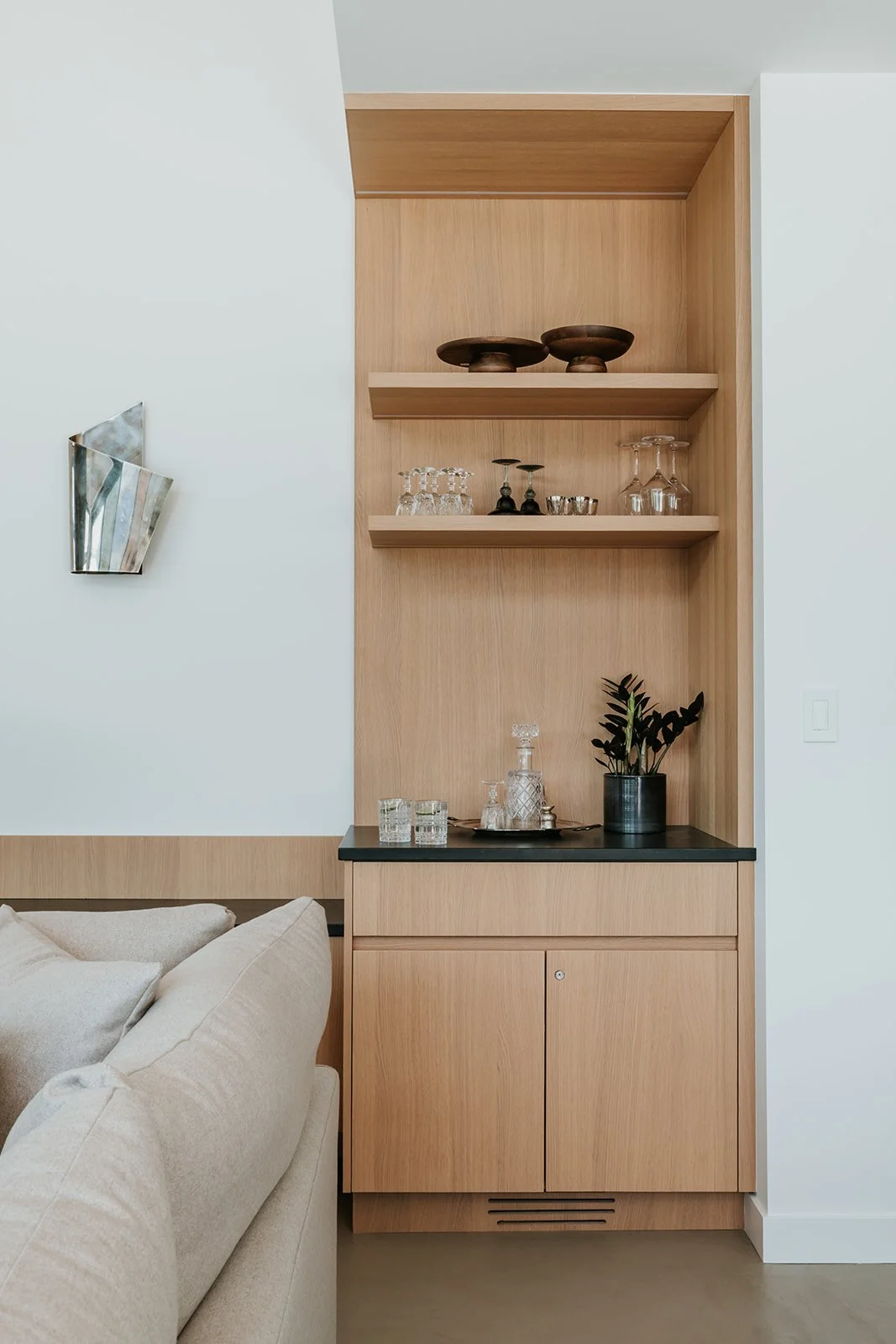 Sunstone Built-in bar nook with oak cabinetry and open shelving — new-build interior design in Pemberton, BC by LRD Studio. Photography by Darby Magill.