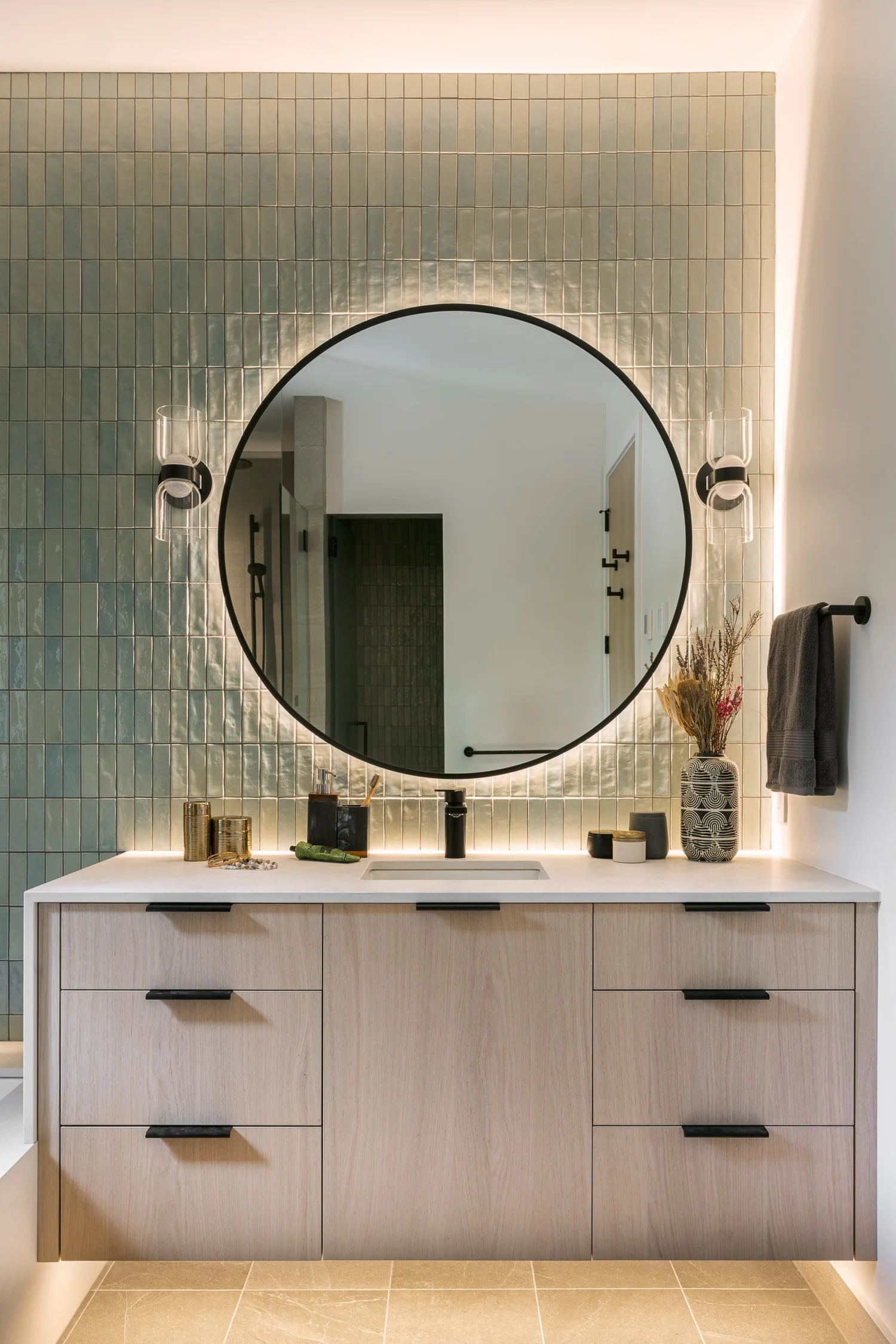 Tapleys Underlit countertop with contemporary flattened gooseneck faucet — full renovation interior design in Whistler, BC by LRD Studio. Photography by Matt Anthony.