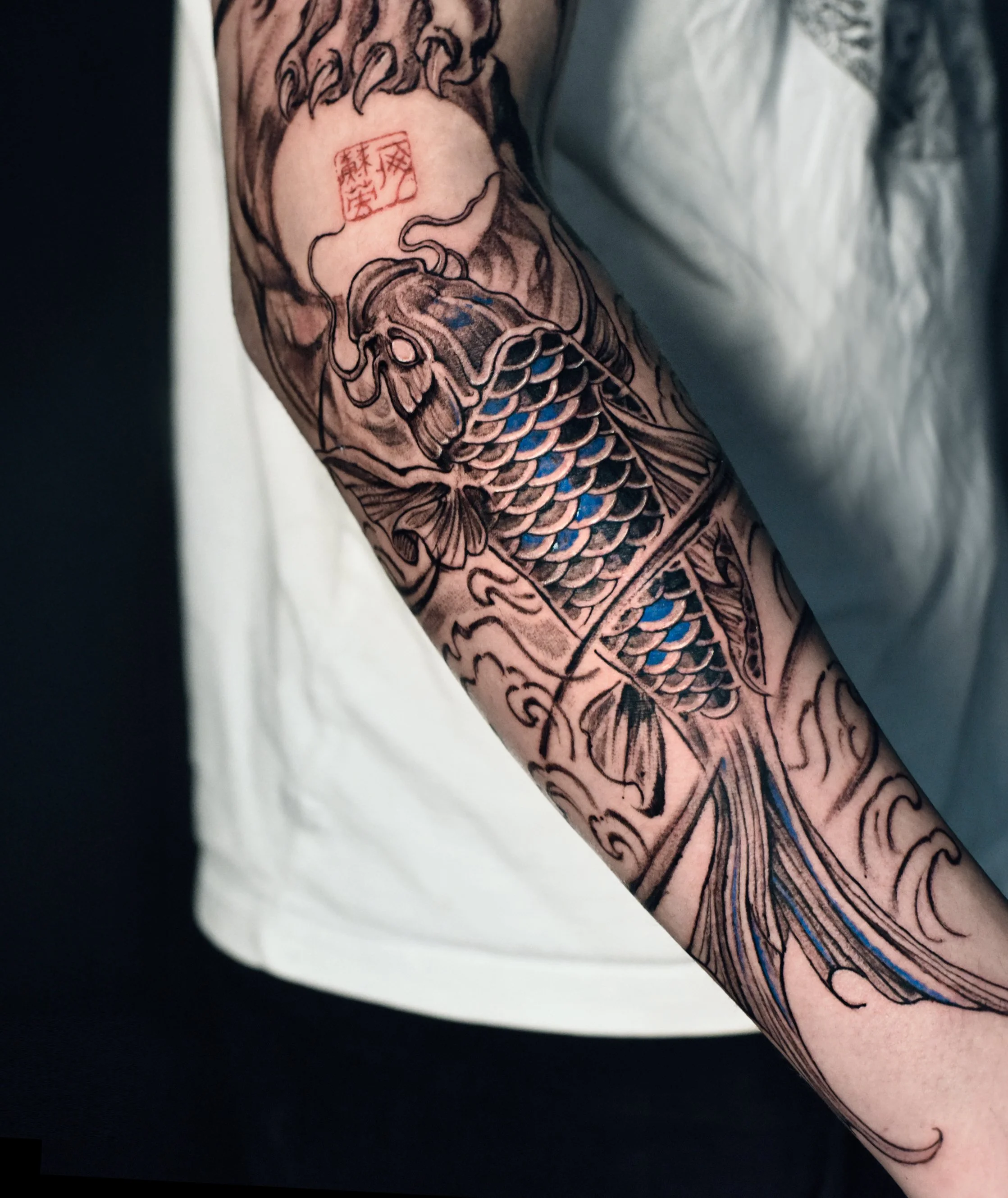 Koi fish tattoo done by kaho inkshop, traditional asian style koi tattoo. located in los angeles, and providing services in san francisco, san diego and new york