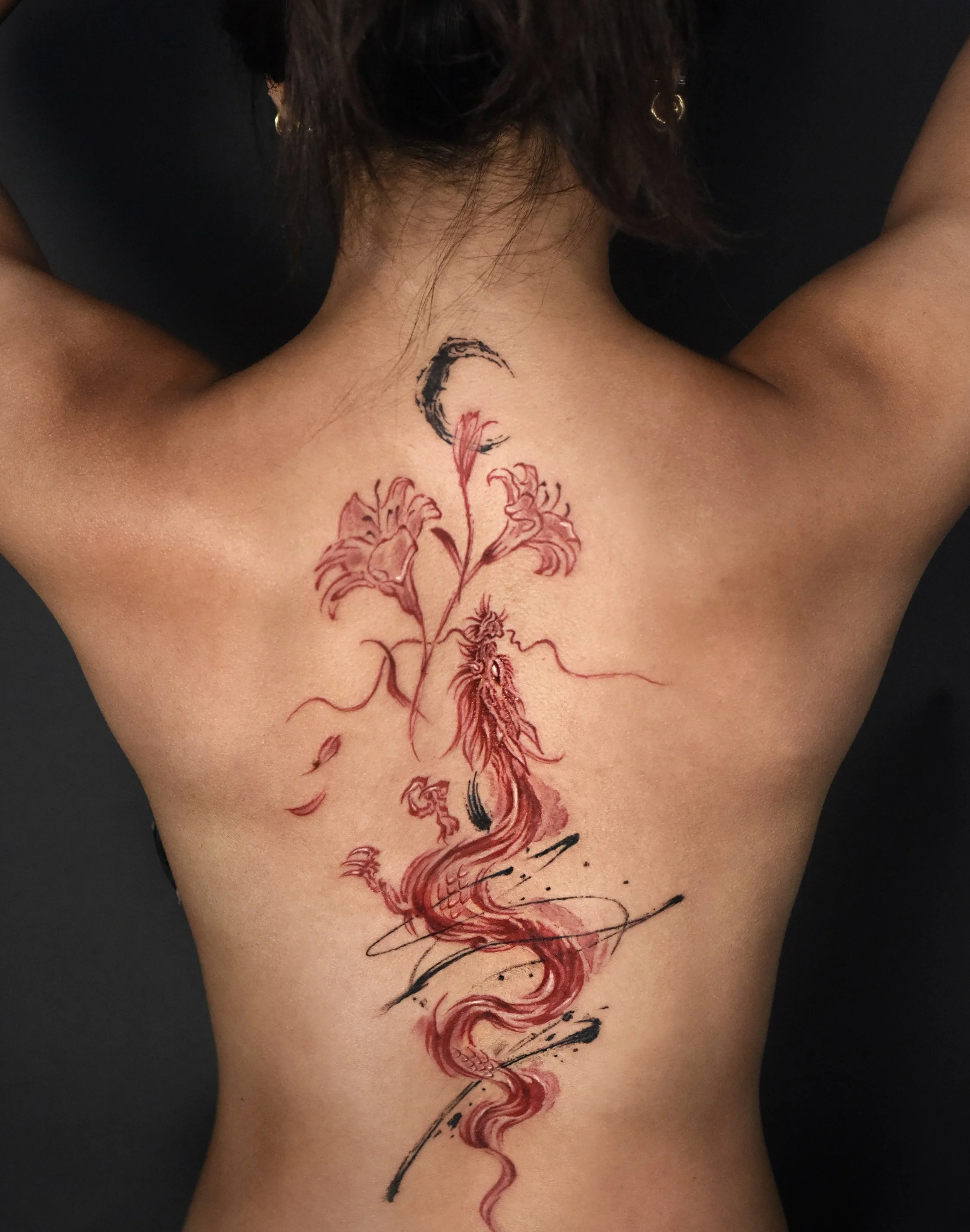 Red ink brush stroke style dragon tattoo, a large scale back piece tattoo. created and design by KaHo Inkshop. a los angeles based artist specialize in Asian arts and brush style