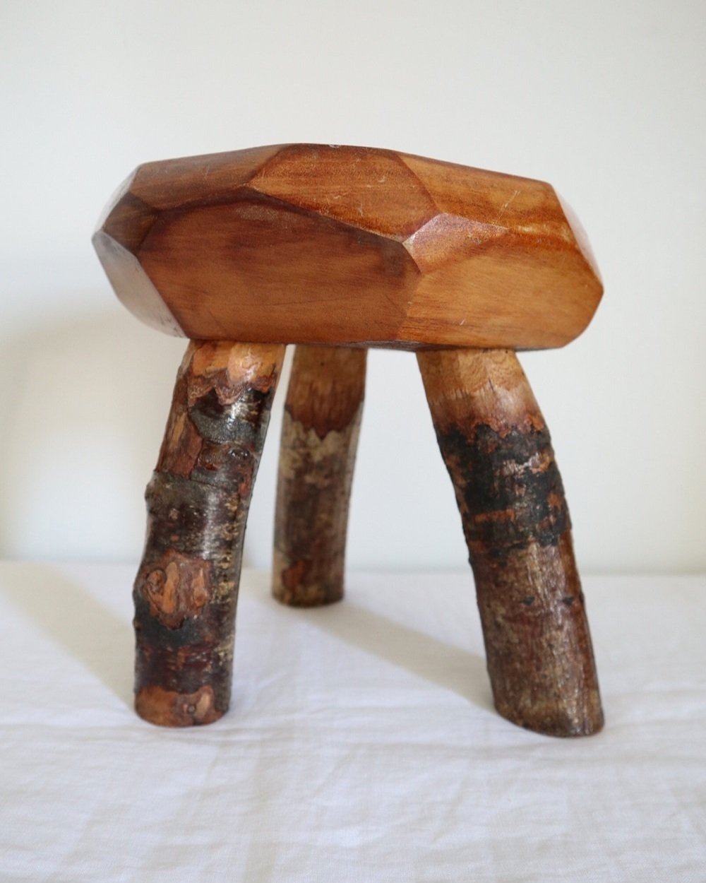 Vintage small rustic folk art handmade wooden stool from Fenterleigh Woodcraft, Tintagel Cornwall, Circa 1940s.