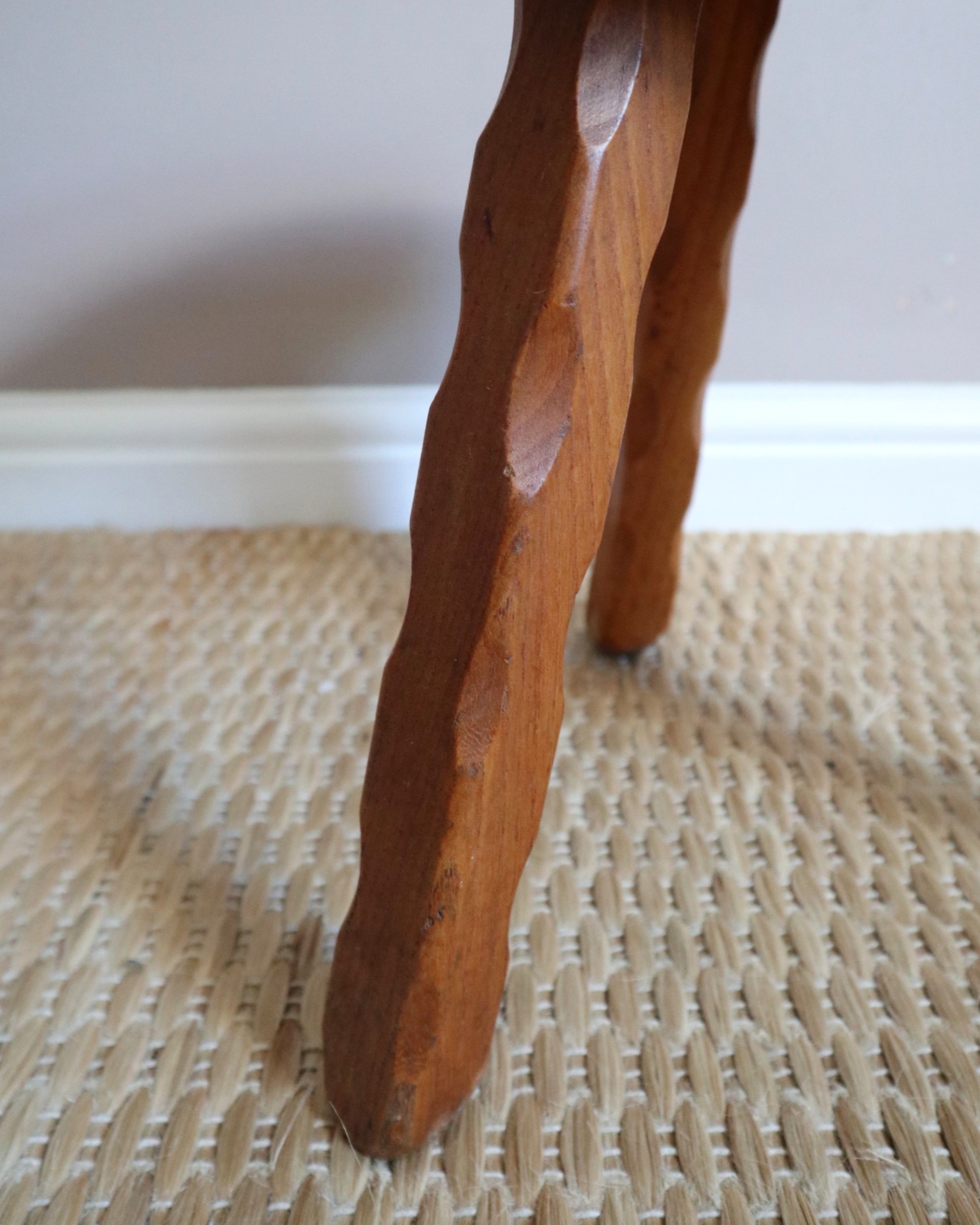 Vintage rustic handmade warm wooden tripod stool with carved legs. Stamped 'John Chapman Woodcrafts Northwood'.