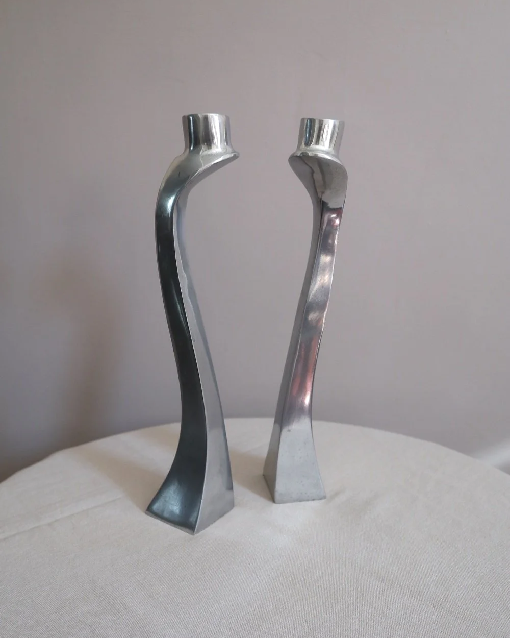 Pair of tall, elegant 1980s Modernist cast aluminium candleholders, likely 'Nessie' style designed by Matthew Hilton.