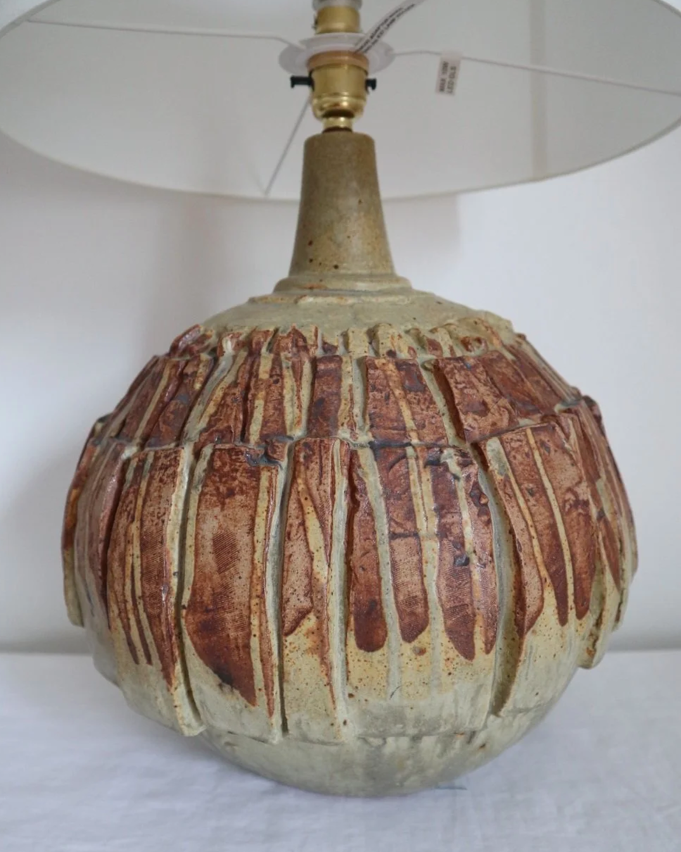 Large mid century Brutalist Bernard Rooke spherical art pottery table lamp with graduated slab sections and matt brown glaze. England, circa 1960s.