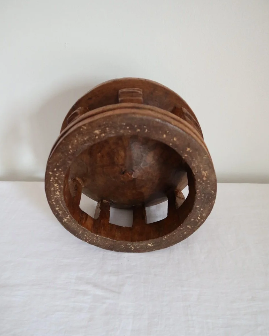 Vintage Nigerian small circular low stool carved from one piece of wood with decorative etchings to surface.