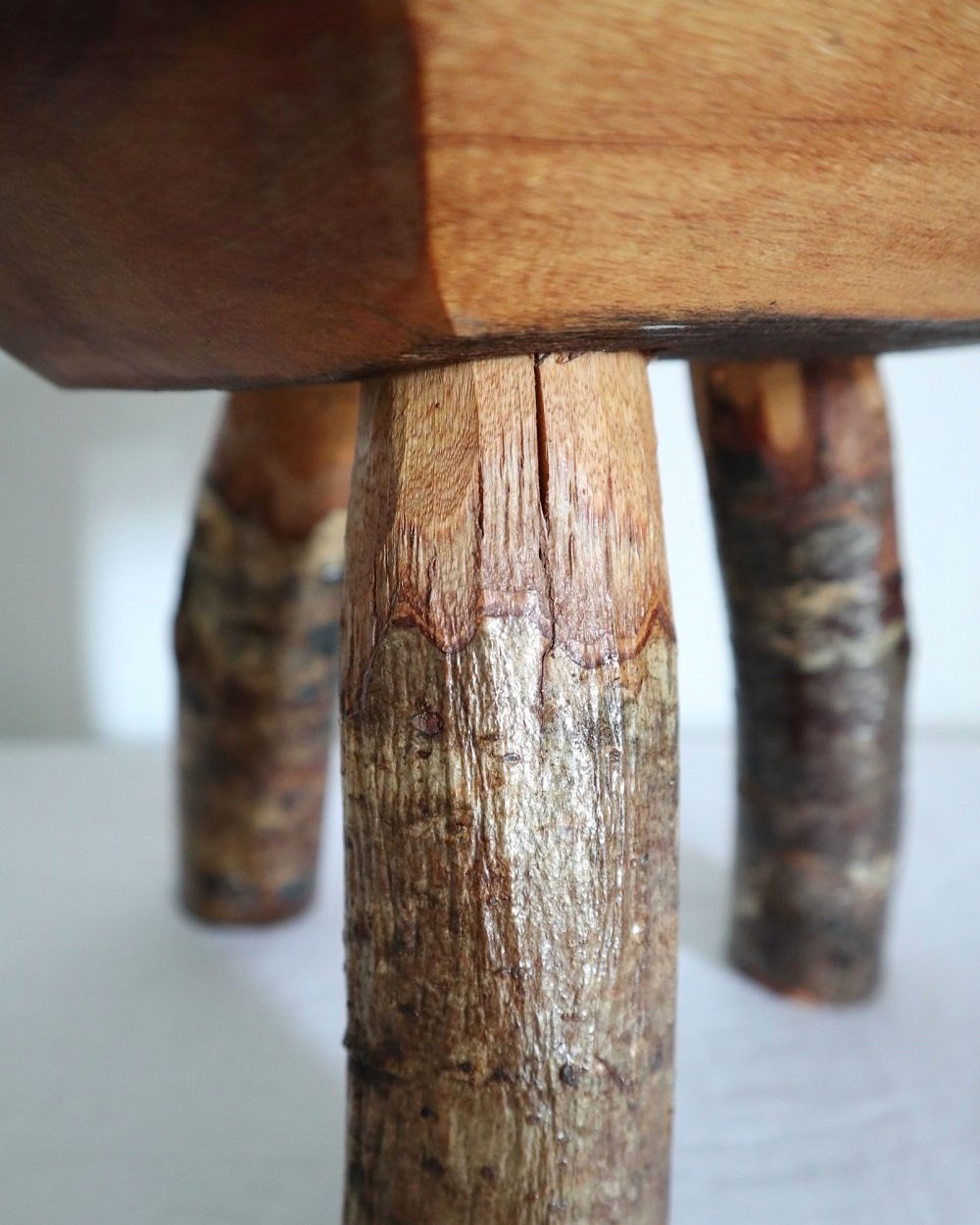 Vintage small rustic folk art handmade wooden stool from Fenterleigh Woodcraft, Tintagel Cornwall, Circa 1940s.