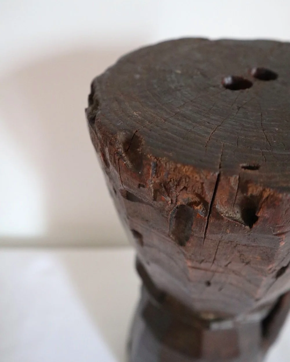 Heavy primitive sculptural carved wooden mortar with handle.