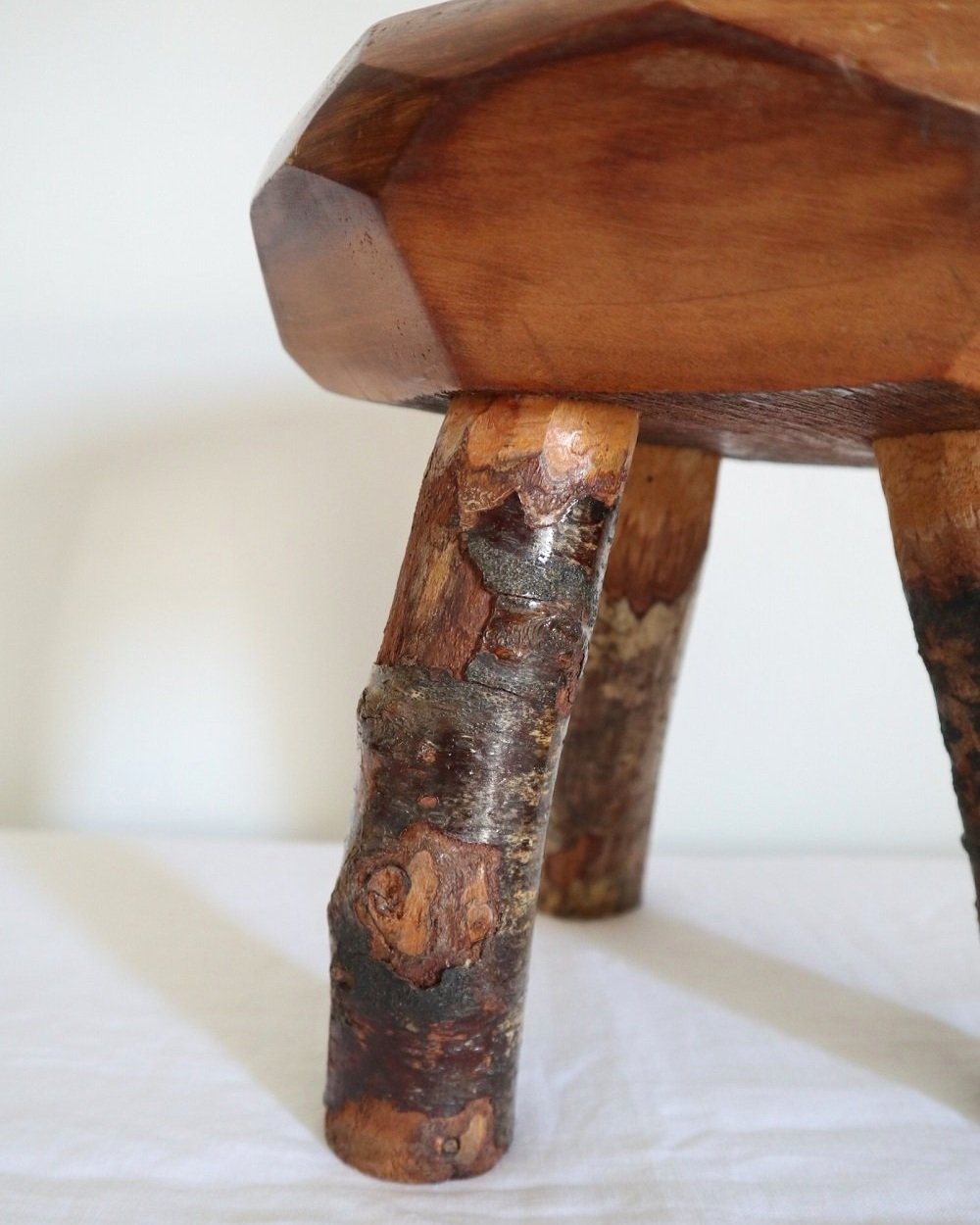 Vintage small rustic folk art handmade wooden stool from Fenterleigh Woodcraft, Tintagel Cornwall, Circa 1940s.