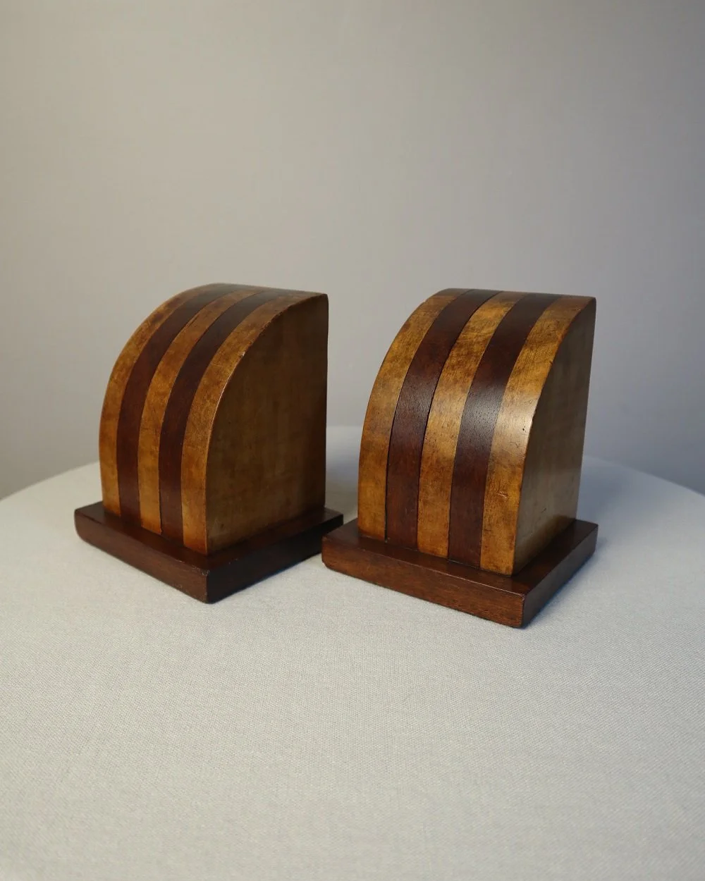 Vintage Art Deco style two tone arched wooden bookends.