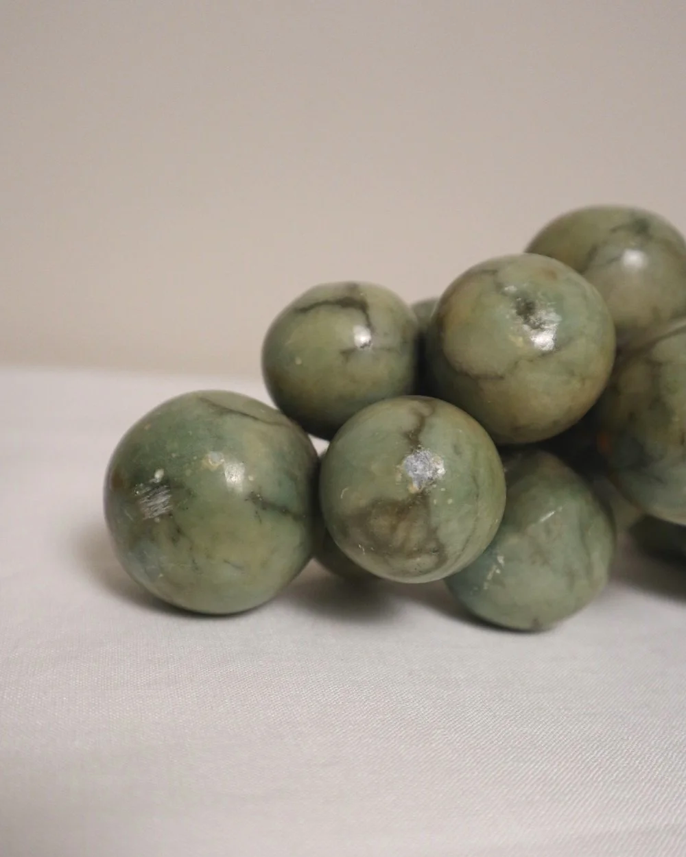 Large 1970s cluster of green alabaster grapes with real vine stem.