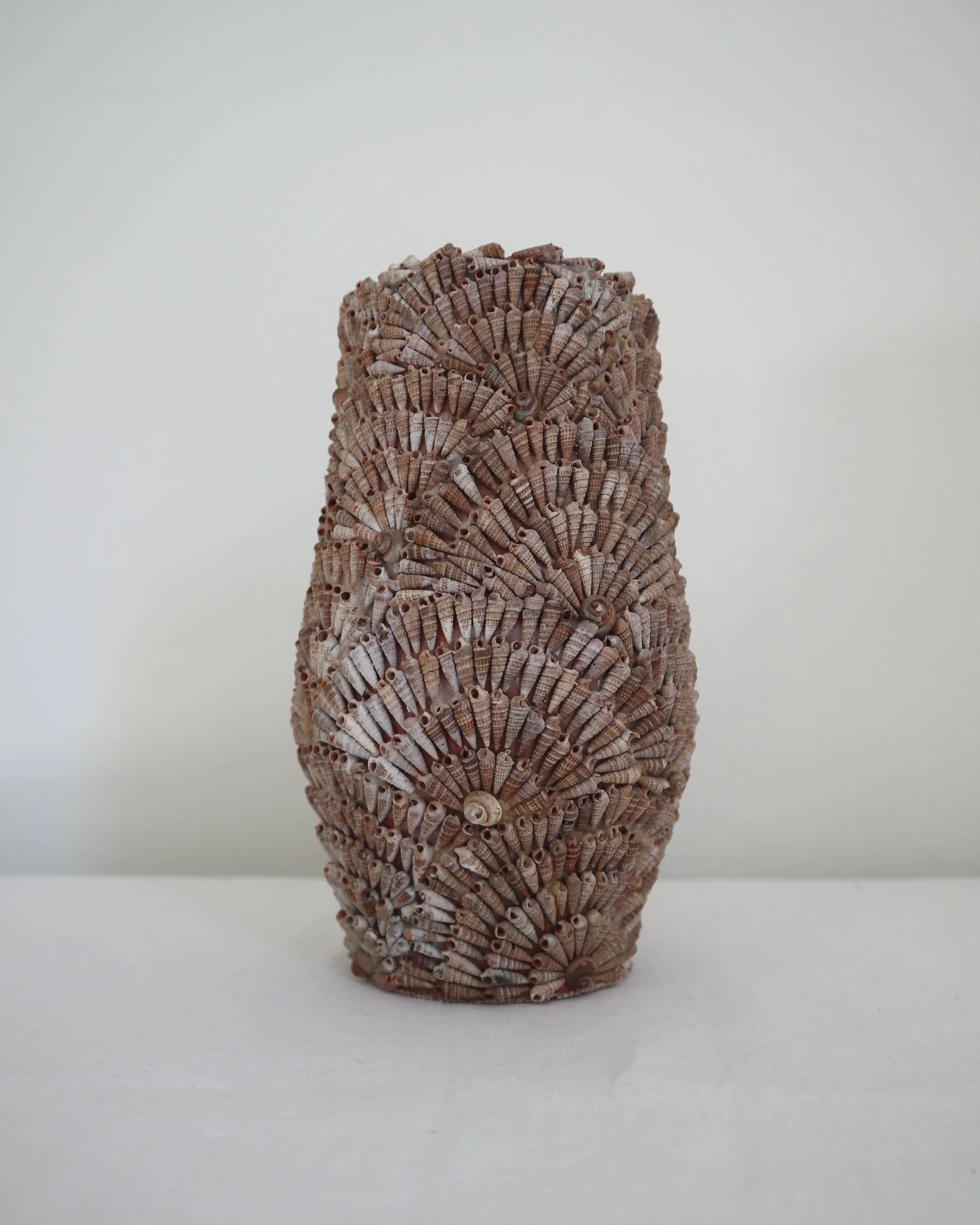 Vintage, handcrafted seashell-encrusted vase or vessel, likely French. Circa 1960s.