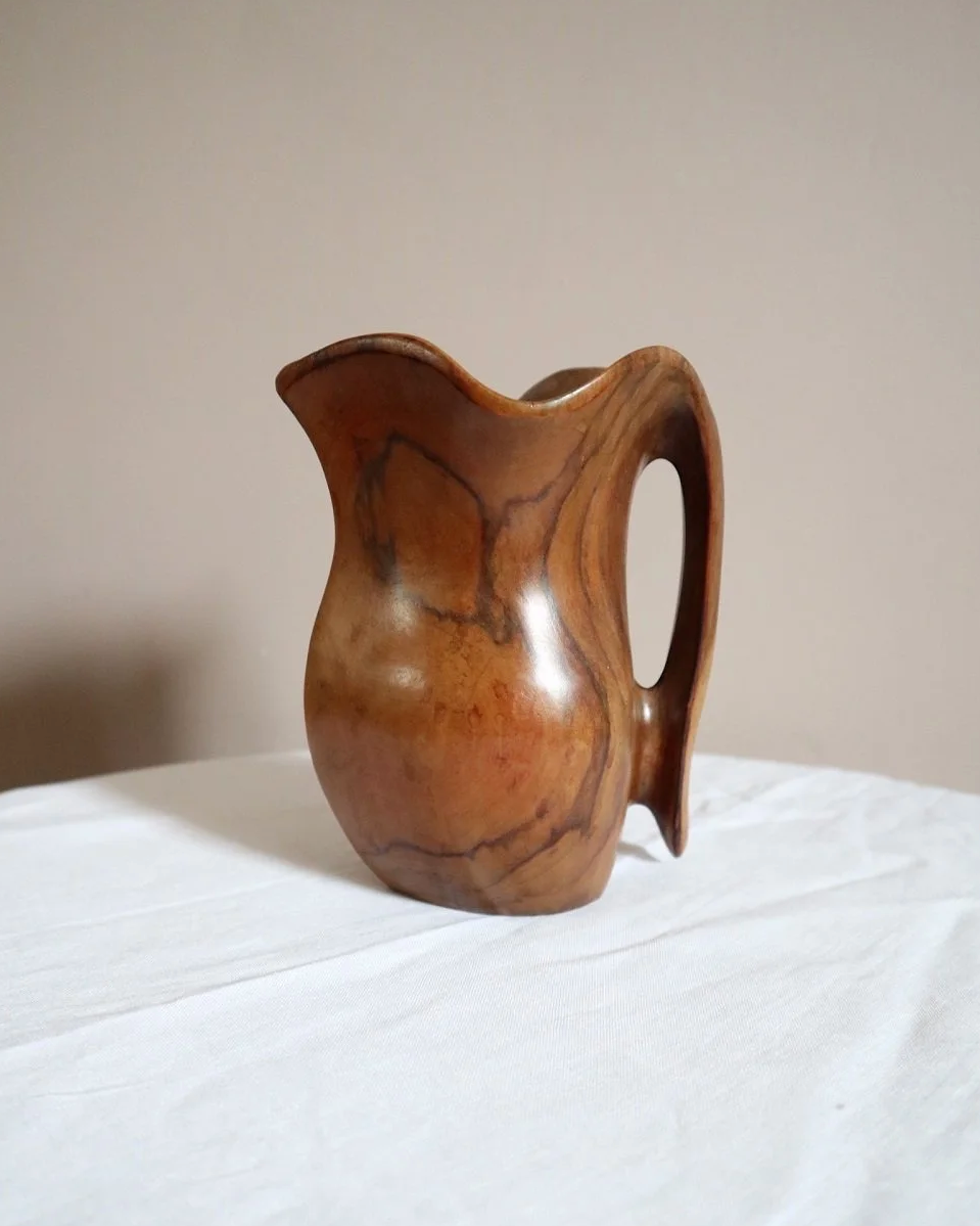 Small mid century hand carved sculptural olivewood jug in the style of Alexandre Noll. Circa 1960s.