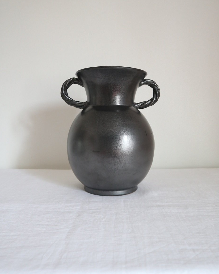 Large glossy, metallic black vase with double twisted handles and contrasting, yellow crackled glaze interior. Typical of Elchinger productions, France. Circa 1950s