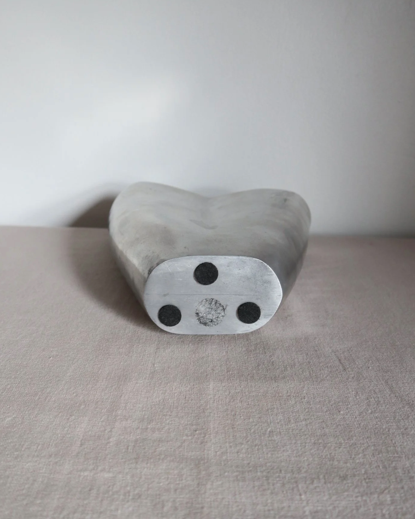 Postmodern heavy cast aluminium vase with sculptural form and four small inset stones. In the style of Anna Efverlund. Circa 1980s. Unsigned.