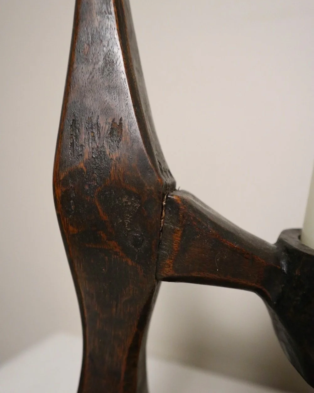 American hand carved dark wooden Brutalist candleholder with block base.