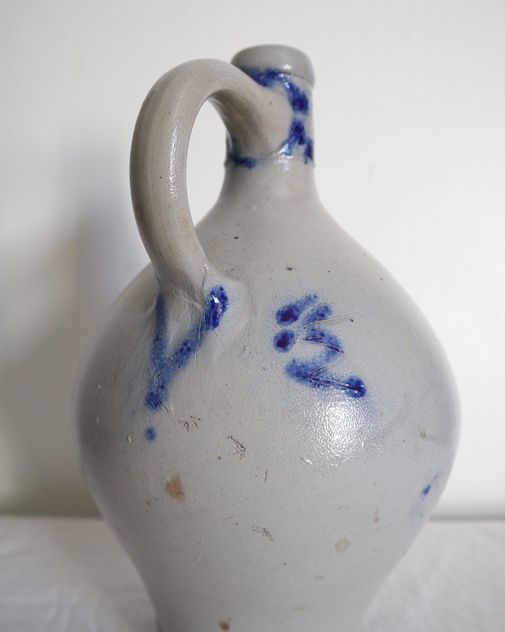 Large vintage German Westerwald salt glazed stoneware flagon with cobalt blue foliage decoration and two bands to the neck.