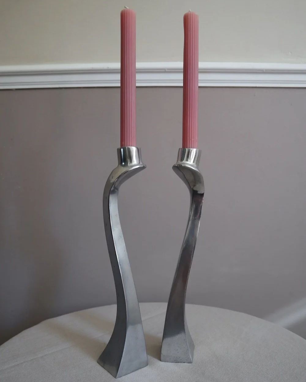 Pair of tall, elegant 1980s Modernist cast aluminium candleholders, likely 'Nessie' style designed by Matthew Hilton.