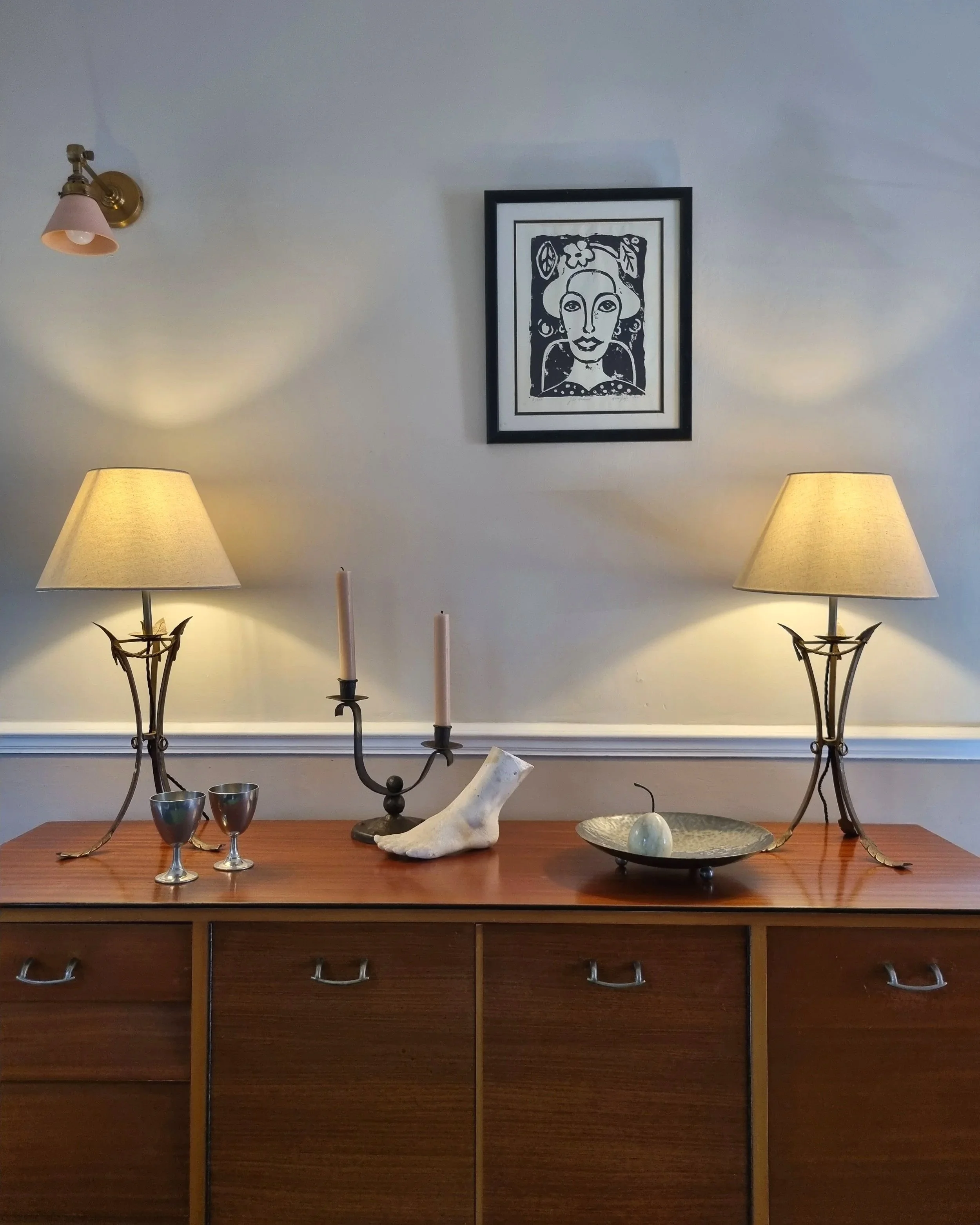 Pair of French style mid century metal tripod table lamps featuring three arrows.