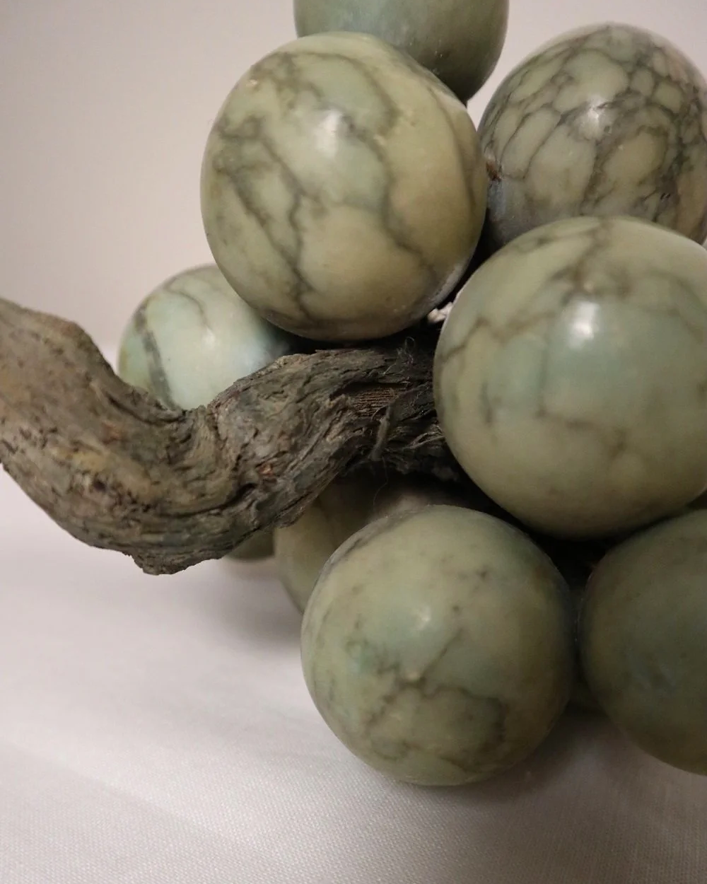 Large 1970s cluster of green alabaster grapes with real vine stem.
