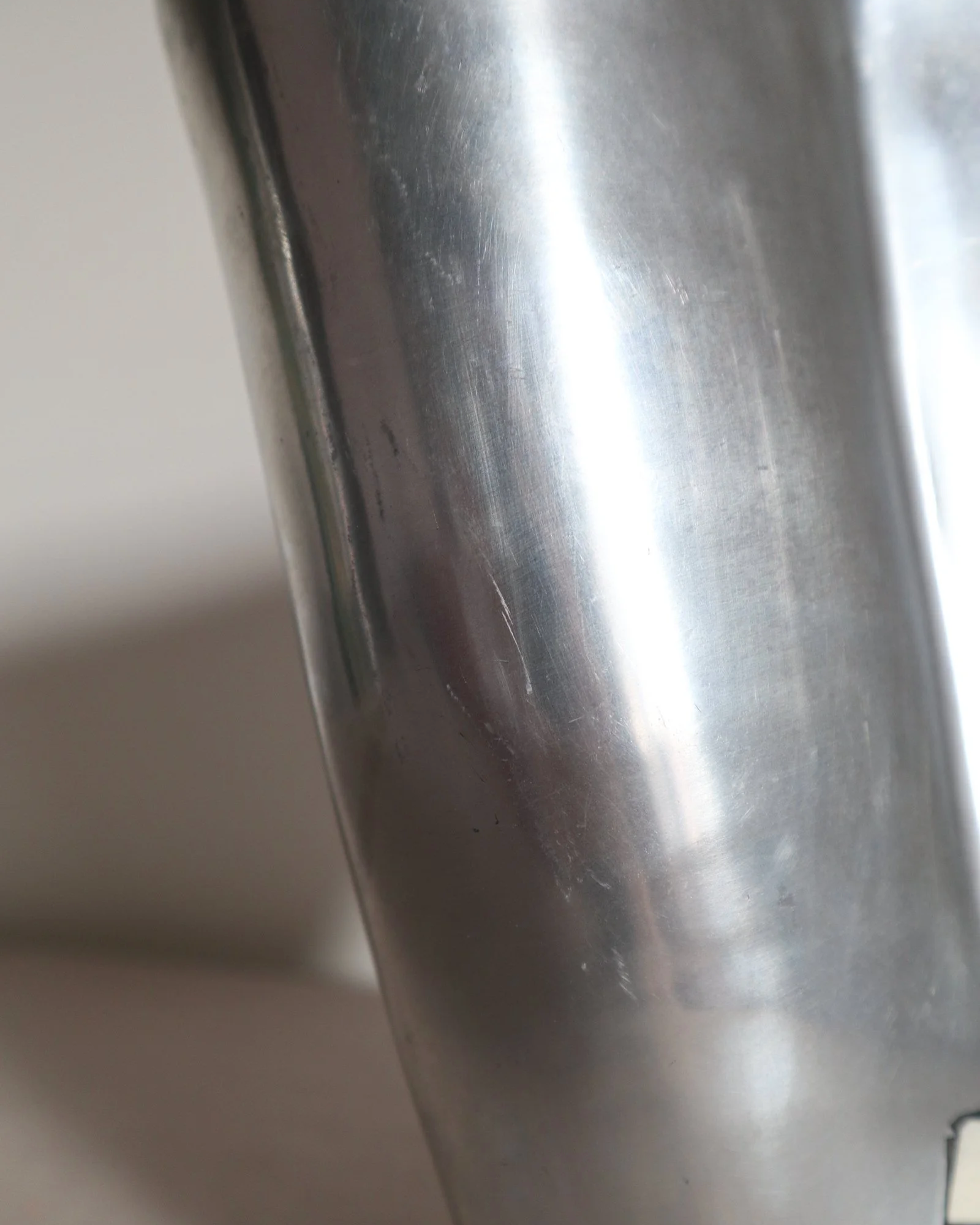Postmodern heavy cast aluminium vase with sculptural form and four small inset stones. In the style of Anna Efverlund. Circa 1980s. Unsigned.