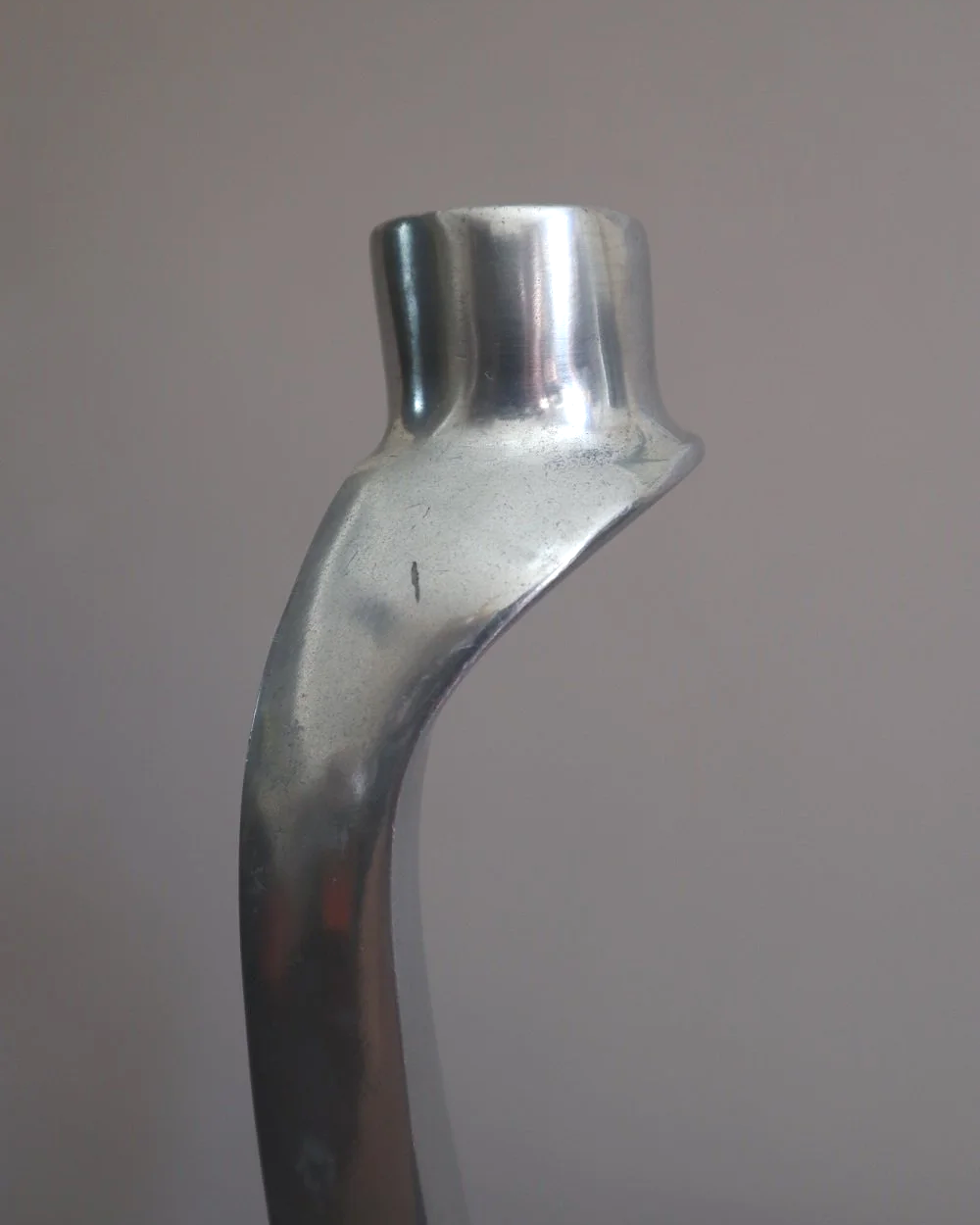 Pair of tall, elegant 1980s Modernist cast aluminium candleholders, likely 'Nessie' style designed by Matthew Hilton.
