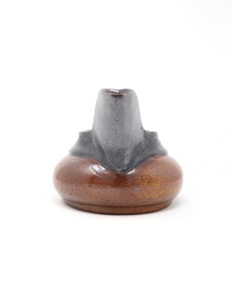 Large Art Deco ceramic tea pot with distinctive wide spout, looped handle and metallic grey and brown speckled glazing in the manner of Vally Wieselthier USA, circa 1940s.