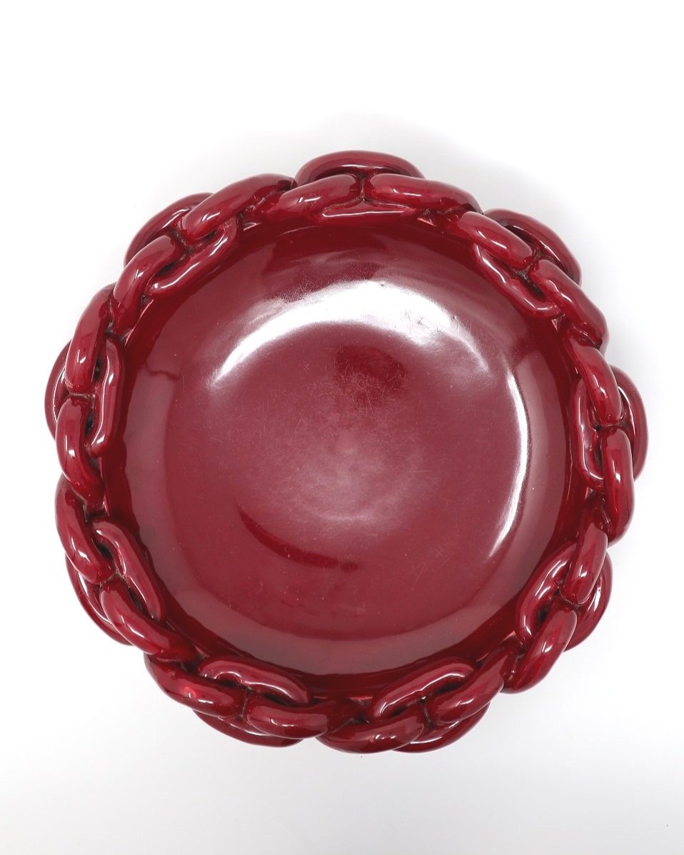 Large, burgundy red glazed ceramic bowl/dish with chain link detailing . In the style of Jerome Massier - stamped Vallauris.
