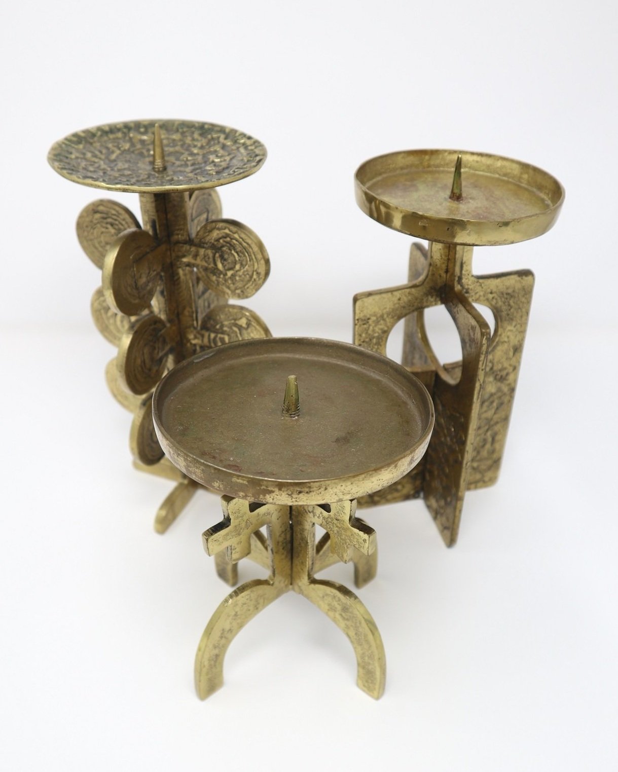Set of three heavy Brutalist brass candlesticks