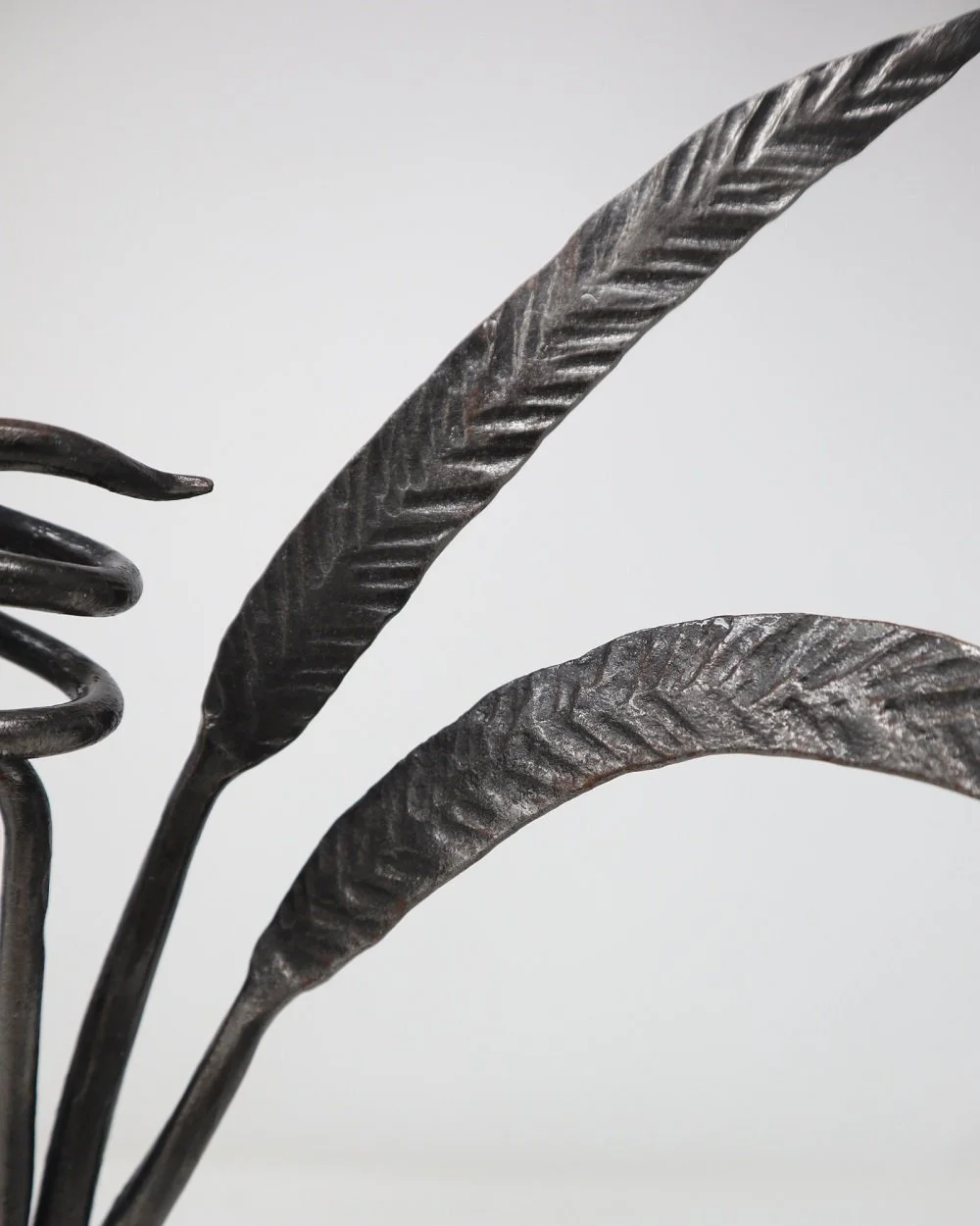 Statement hand forged wrought iron bullrush candle holder.