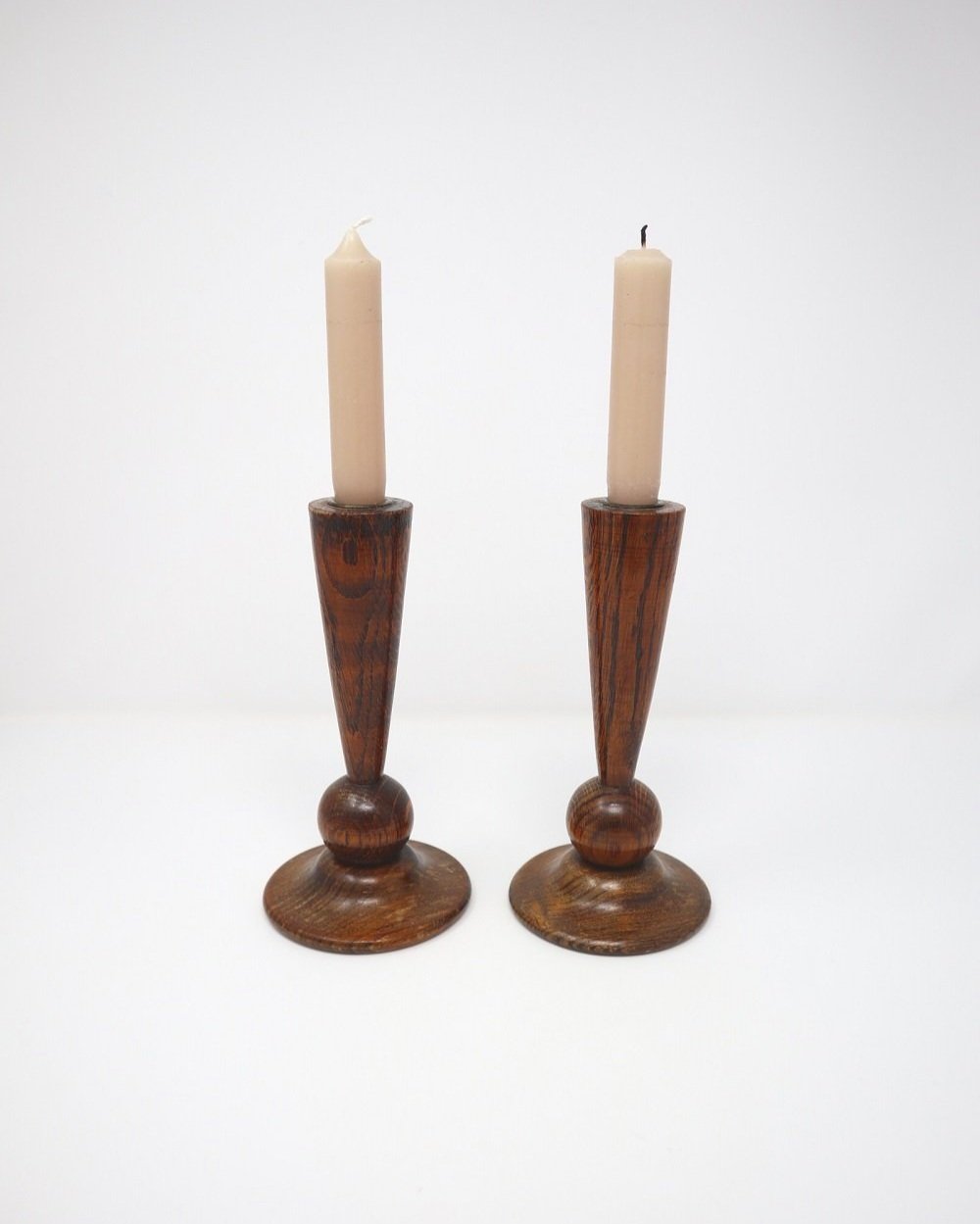 Pair of sculptural Art Deco solid oak carved wooden candlesticks
