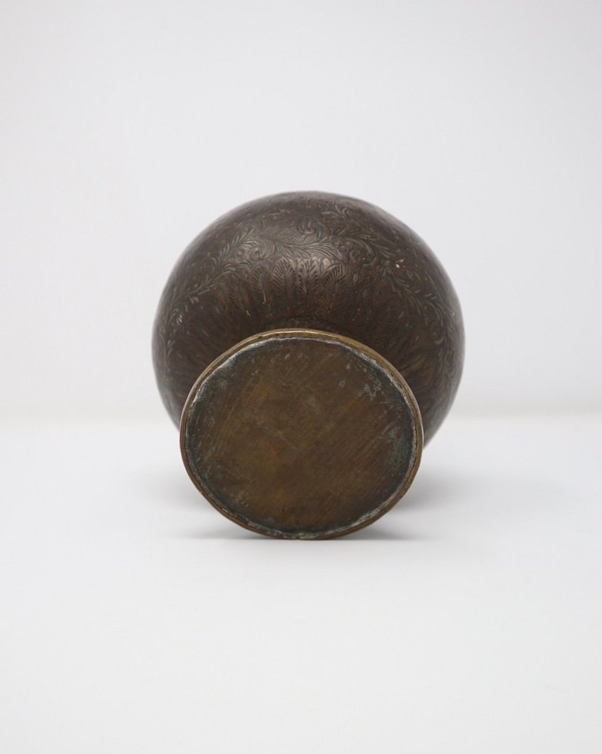 Vintage Indian bronze water vessel ornamental vase with detailed decorative engravings of flora, birds and hindu gods and fluted top. Likely to have been a holy water pot originally from India.