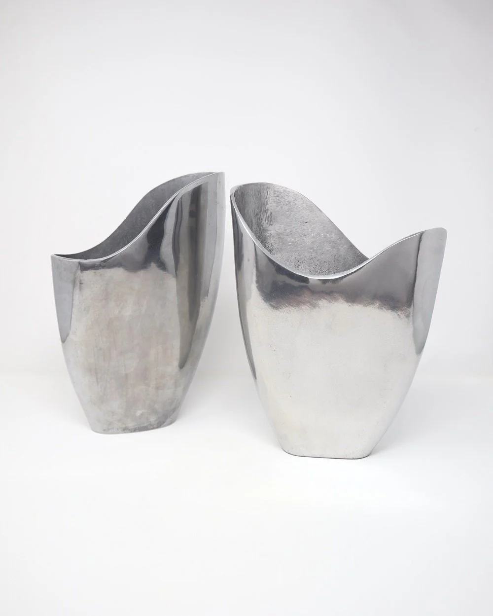 Swedish Postmodern heavy aluminium vase with sculptural organic sloped top, designed by Anna Efverlund for Ikea. Circa 1980s. Unsigned.