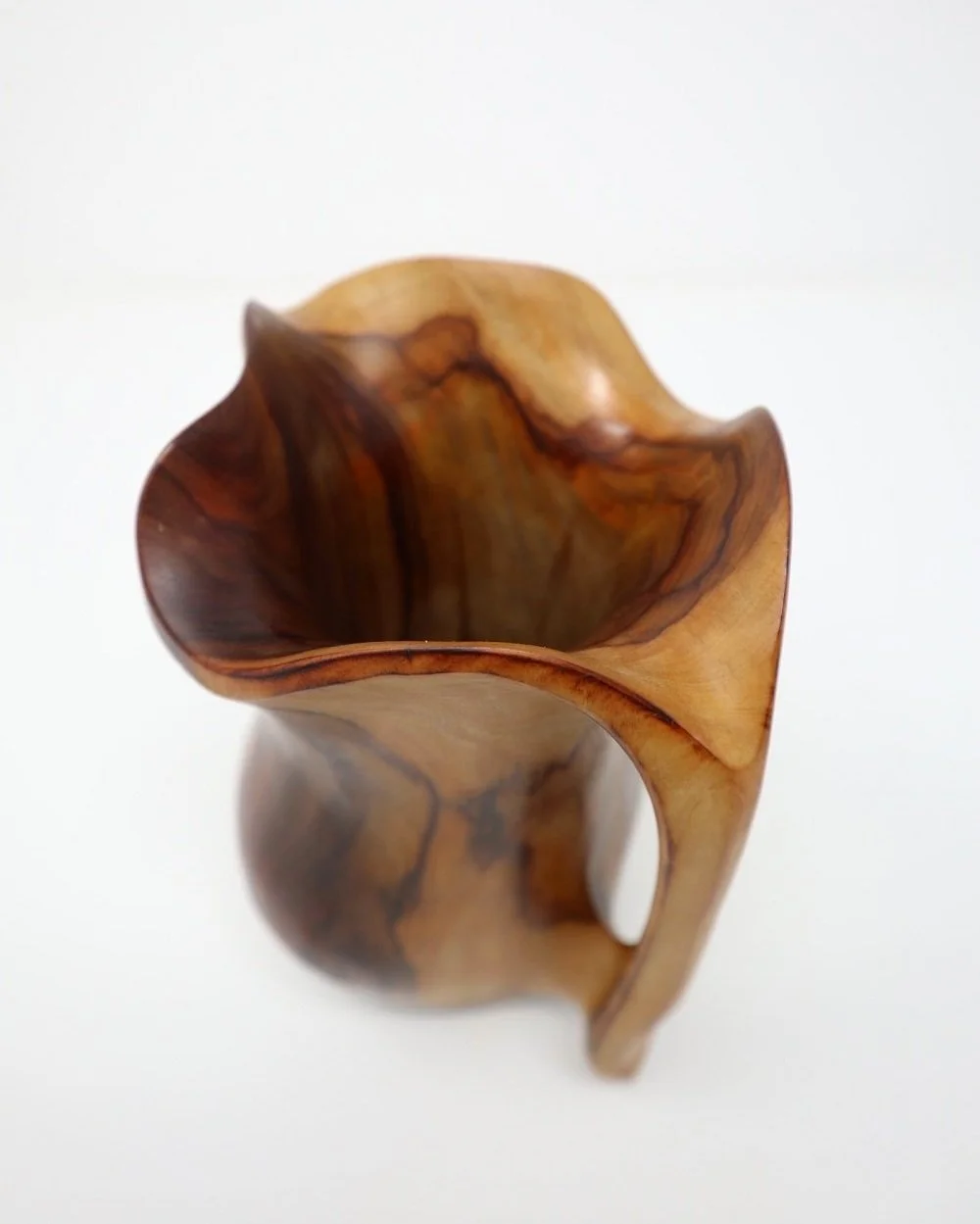 Small mid century Spanish handcarved sculptural olivewood monoxyl pitcher in the style of Alexandre Noll. Beautiful rich, natural wood grain. Marked 'Falcon, Spain'. Circa 1960s.