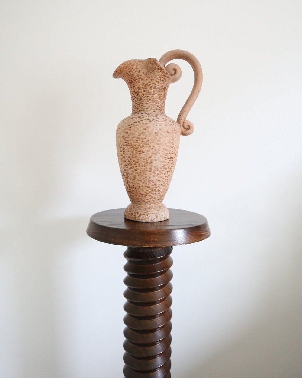A large, turned wooden screw pedestal plinth to display plants or art. Circa 1970s.