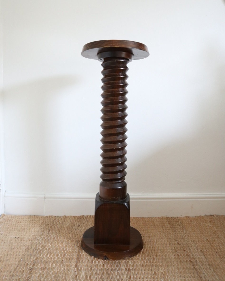 A large, turned wooden screw pedestal plinth to display plants or art. Circa 1970s.