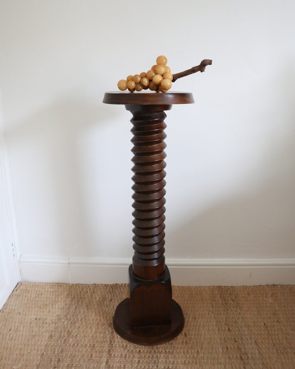 A large, turned wooden screw pedestal plinth to display plants or art. Circa 1970s.