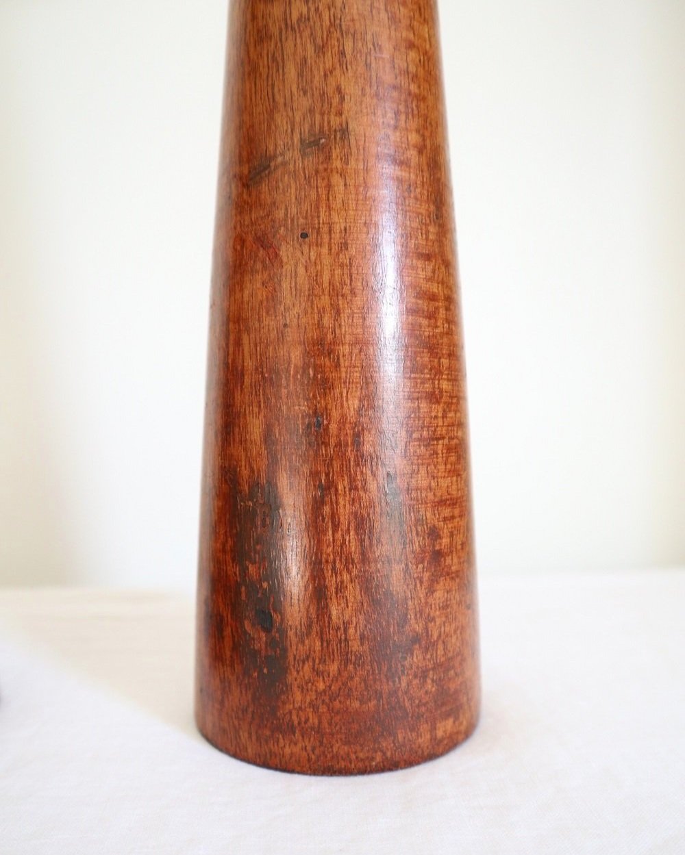 A pair of tall and heavy Midcentury Modern Danish style wooden candleholders with brushed chrome metal tops.