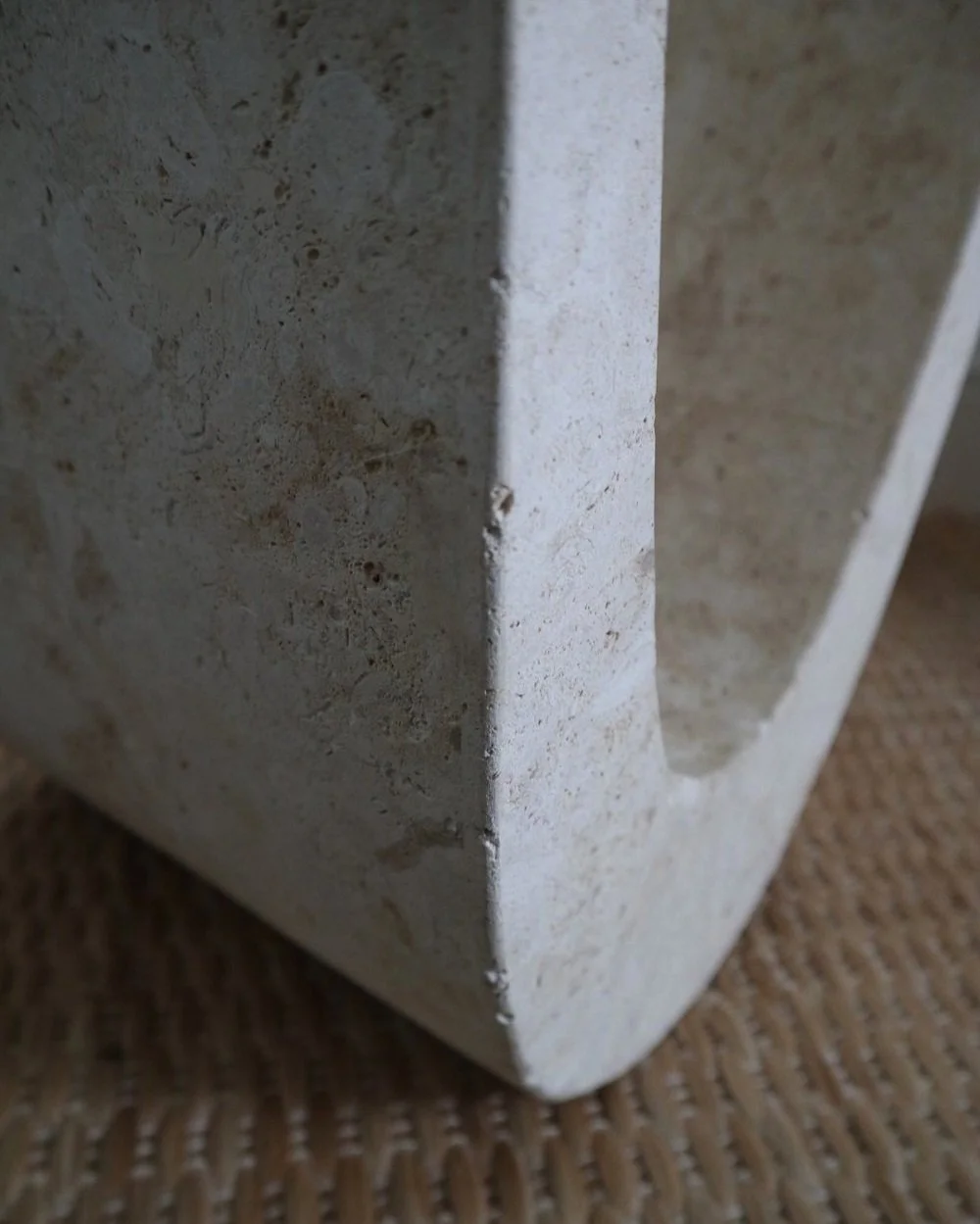Vintage Postmodern glass side table with stone base. Circa 1990s Abstract travertine effect base with layered stone panels - possibly made from Mactan coral stone from the Philippines.