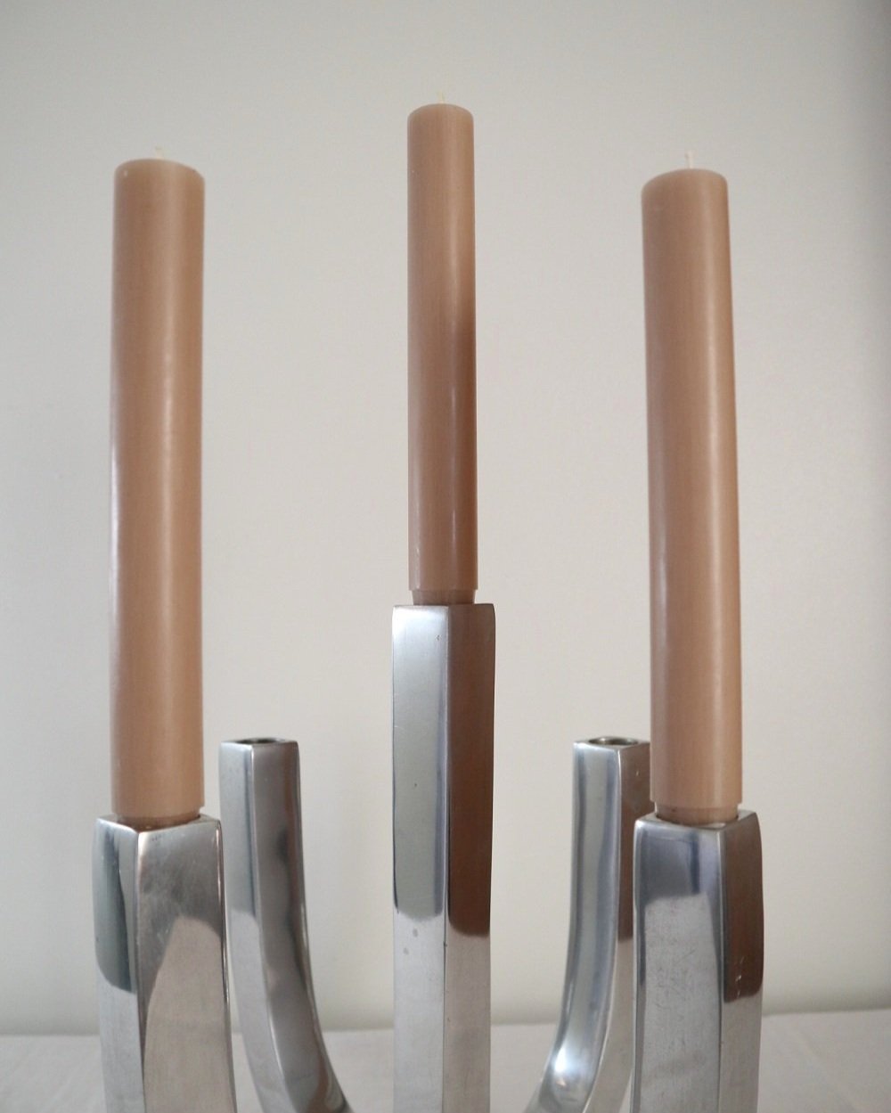 Pair of five arm heavy chrome candelabras.