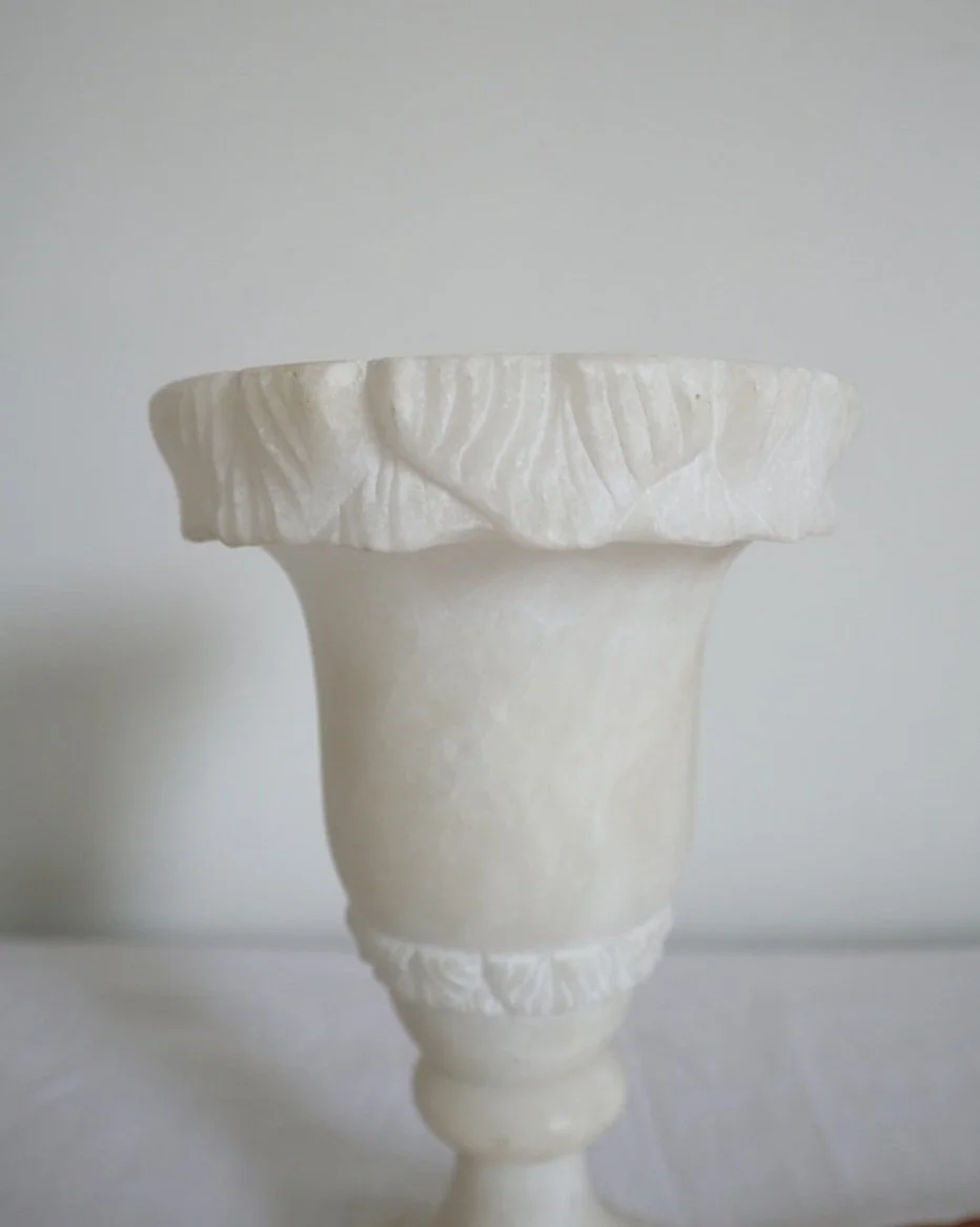Pretty Italian carved alabaster urn table lamp, with delicate petal details. Has a charming light when switched on.
