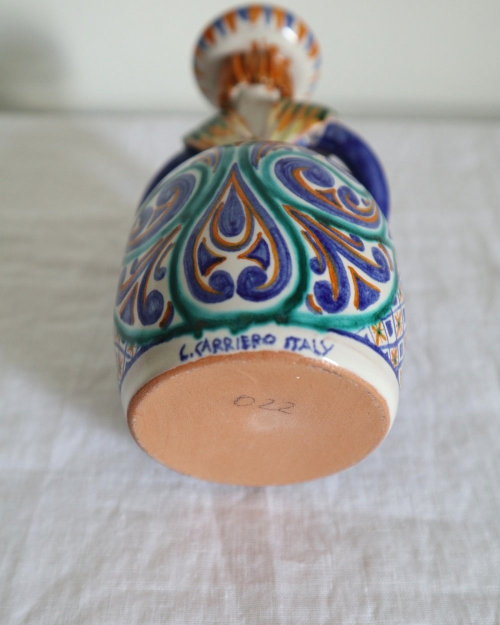 Vintage Italian handpainted majolica ceramic candleholder of a charming lady holding three birds.