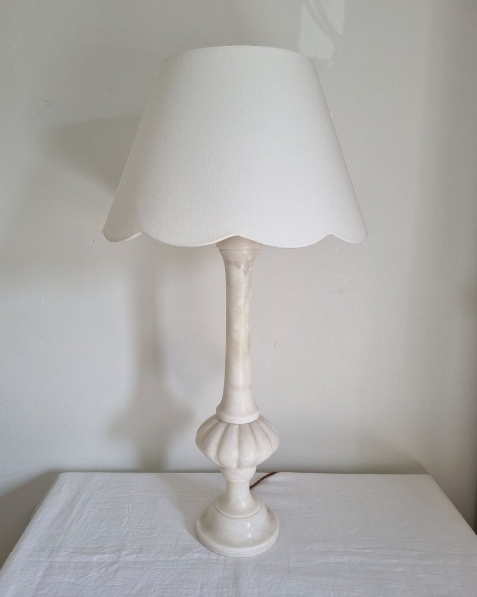 Elegant, tall and heavy carved white marble table lamp with ornate brass detailing. Comes with new, white cotton scallop shade.