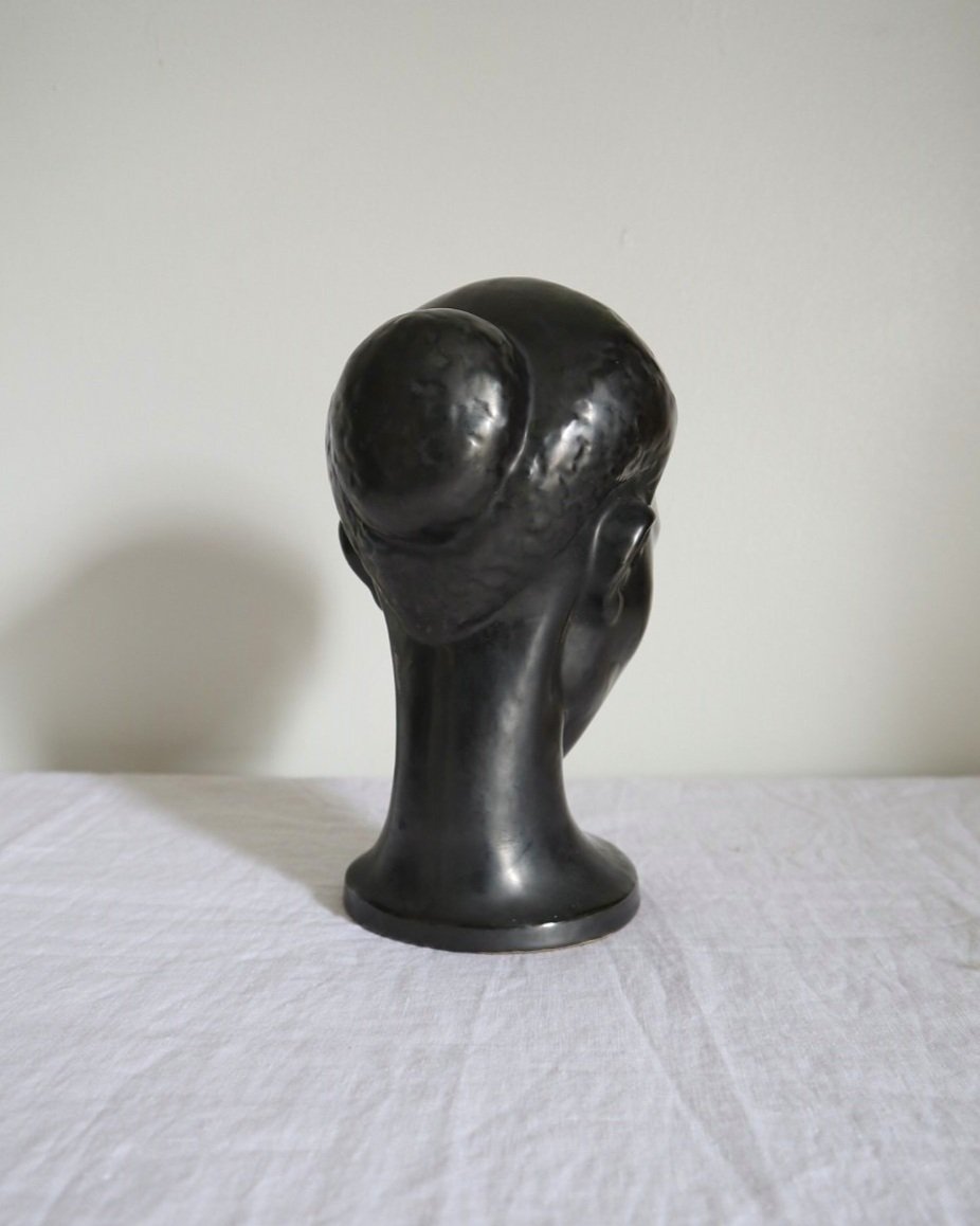Rare mid century metallic black ceramic woman's head with eyes closed. Marked Dartmouth Devon England to base