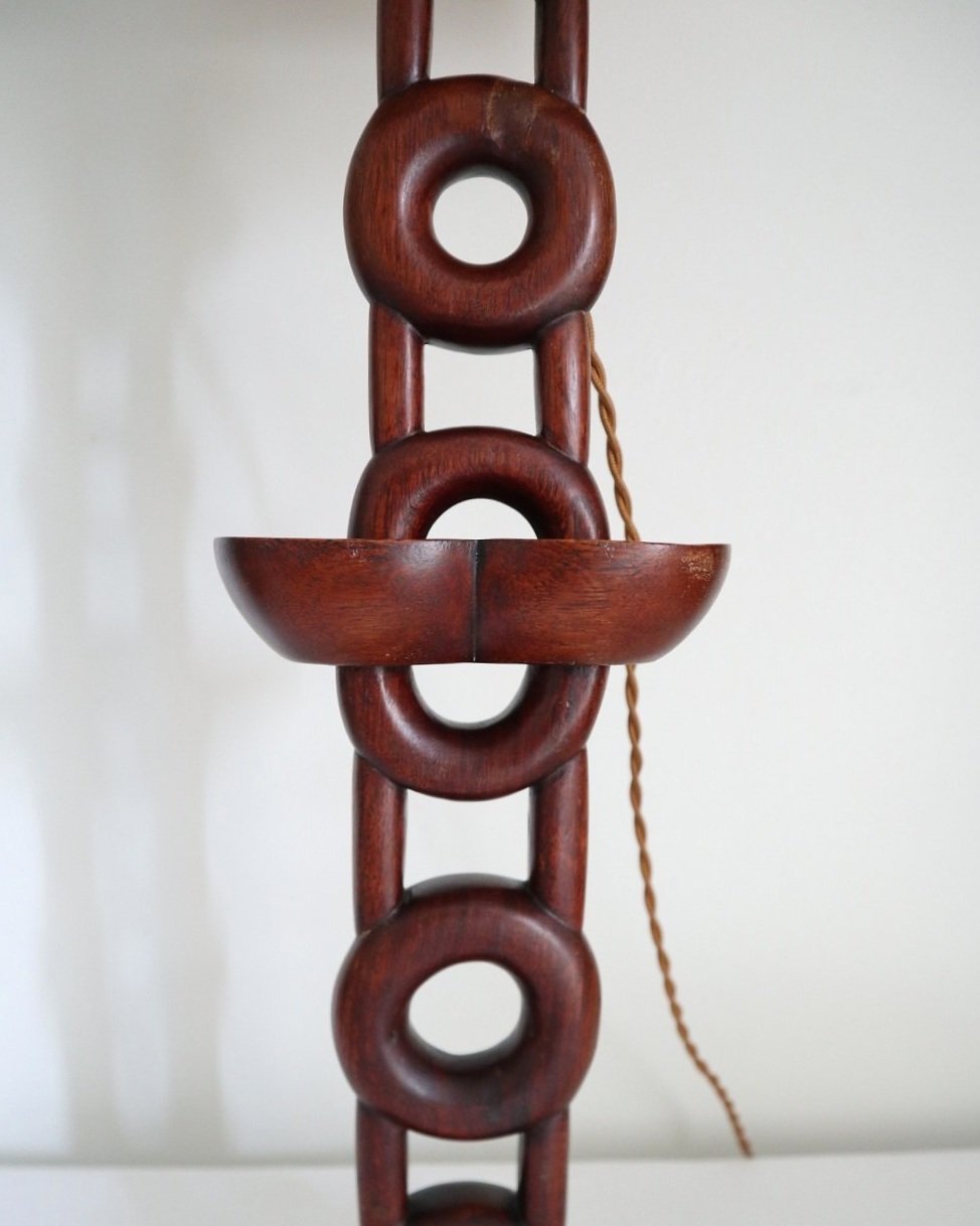Tall mid century sculptural hand carved warm wooden totem table lamp with original hessian lampshade. Circa 1960s.